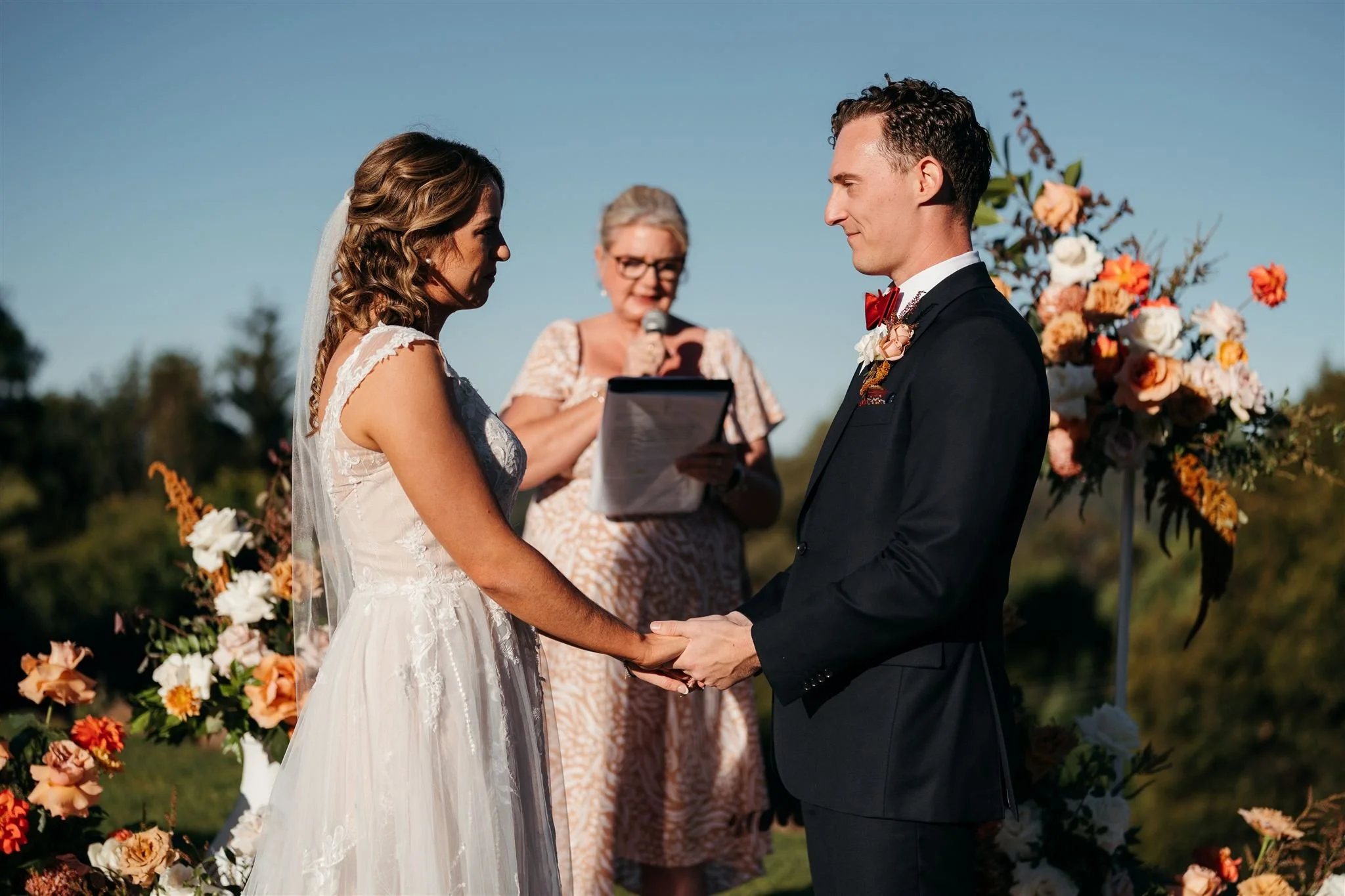 Formal outdoor wedding ceremony with professional Gold Coast marriage celebrant