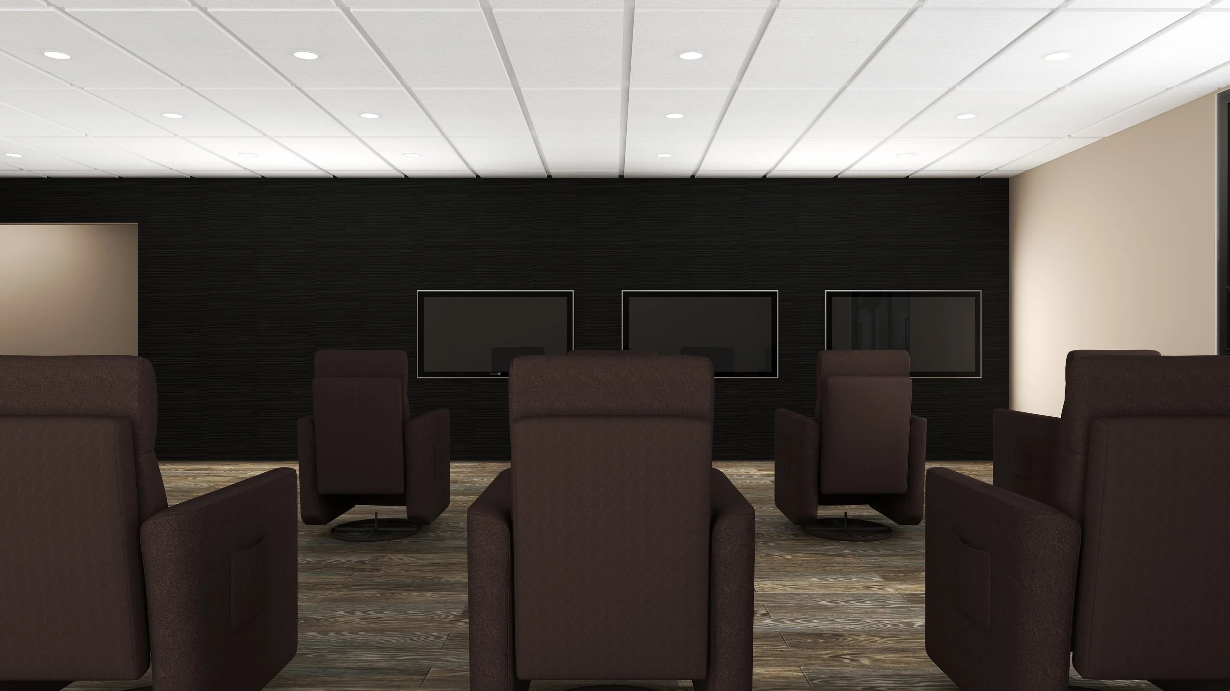 View of a modern conference room with brown armchairs arranged in front of a black wall with three flat-screen televisions mounted on it. The ceiling has recessed lighting, and the floor is covered with wood-patterned flooring.