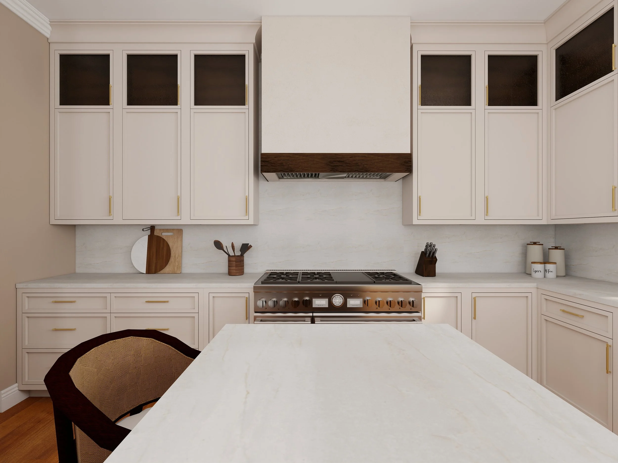 View of a modern kitchen with white cabinets, a marble countertop, and a stove. There is a wooden cutting board and some utensils on the counter, with jars labeled 'Sugar' and 'Honey' on the right side.