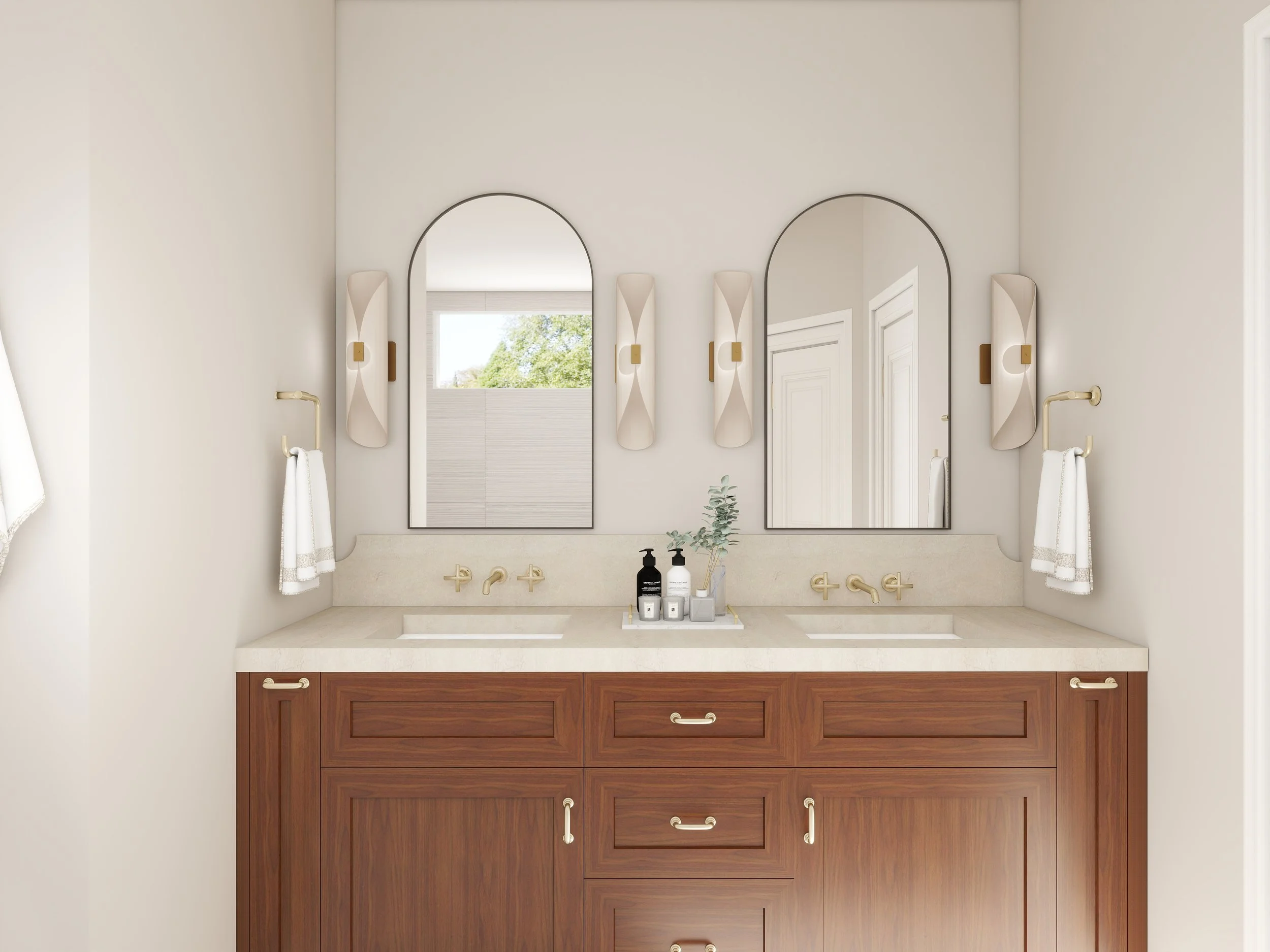 Modern bathroom vanity with a white marble countertop, two rectangular mirrors, wall-mounted lights, a small plant, and bottles of soap, with a window showing a view of trees outside.