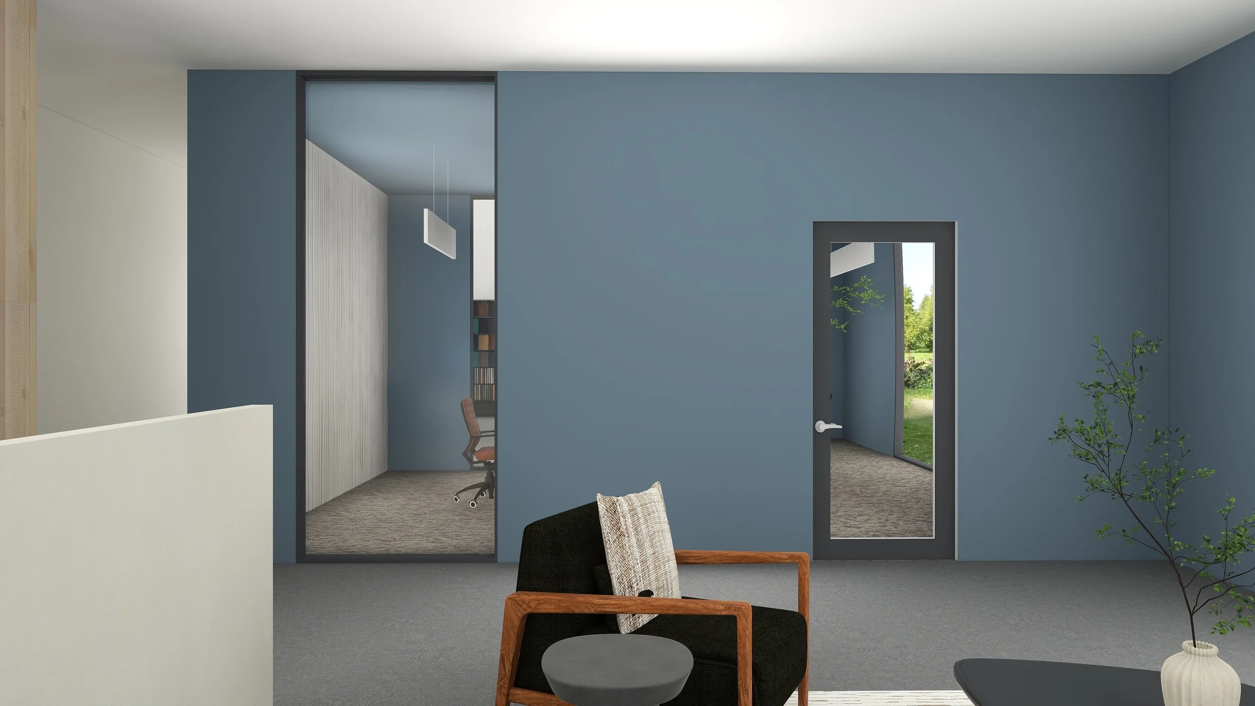 Interior view of a modern office space with blue walls, a black armchair with a beige pillow, a small round black table, and a potted plant, with windows showing outdoor greenery.