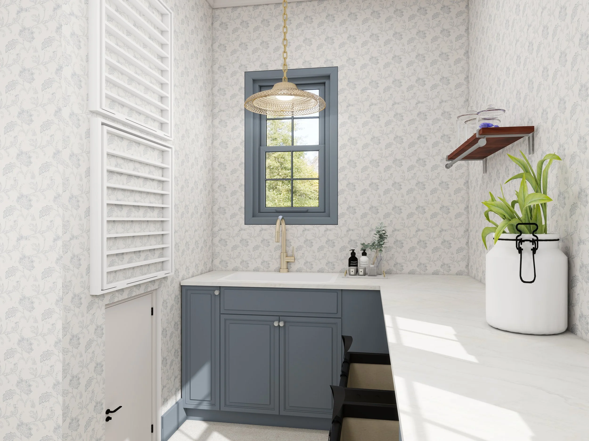 A bright bathroom with floral patterned wallpaper, a window with blue framing, a hanging wicker light fixture, a white countertop with a sink, and a blue cabinet below. There are toiletries on the counter, a floating shelf with jars, and a large whit