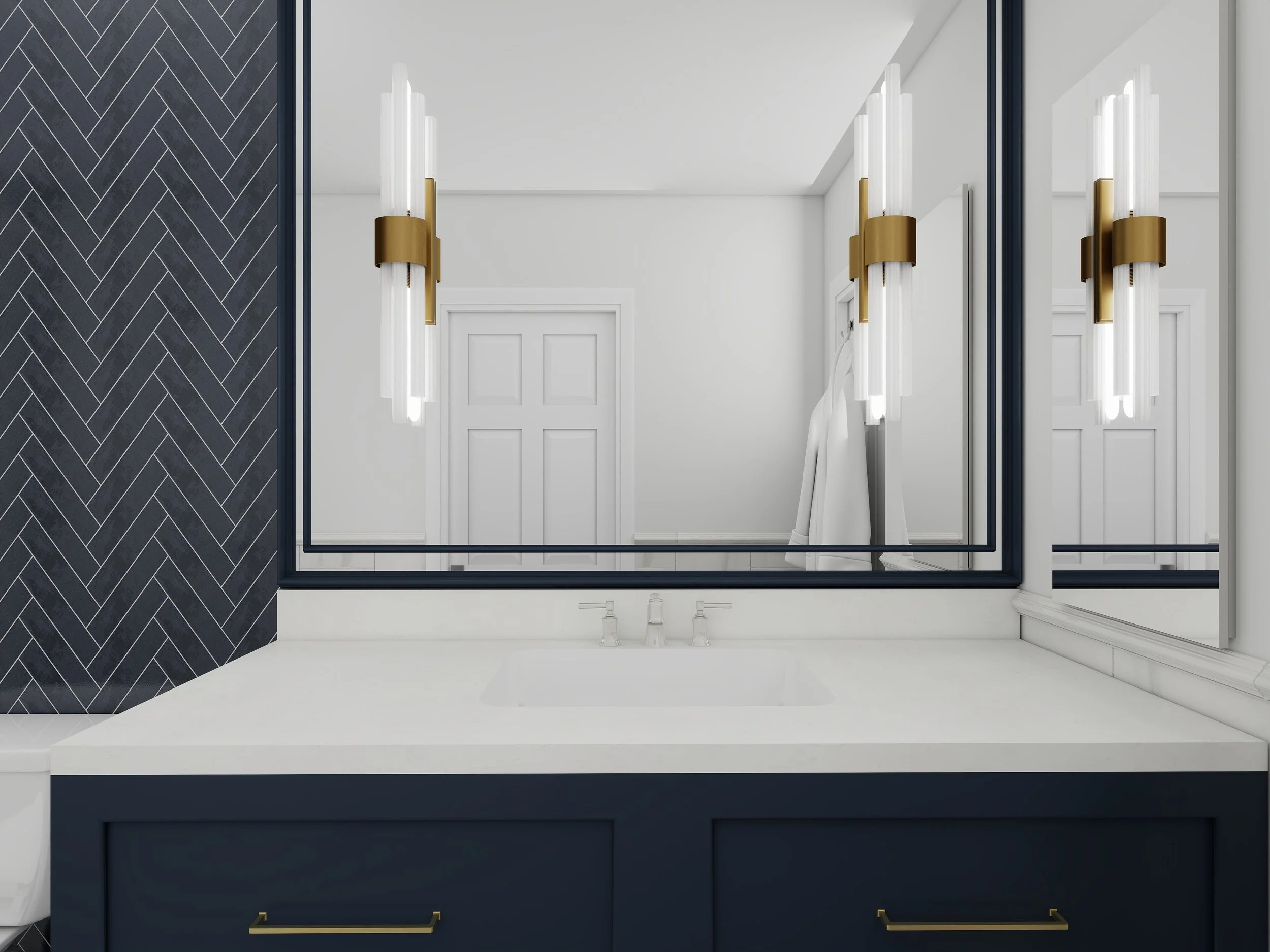 Bathroom vanity with navy blue cabinet, white countertop, and gold hardware, large mirror above, black framed mirror, wall sconce with vertical white tubes and gold accent, black and white herringbone patterned wall, door in the background.