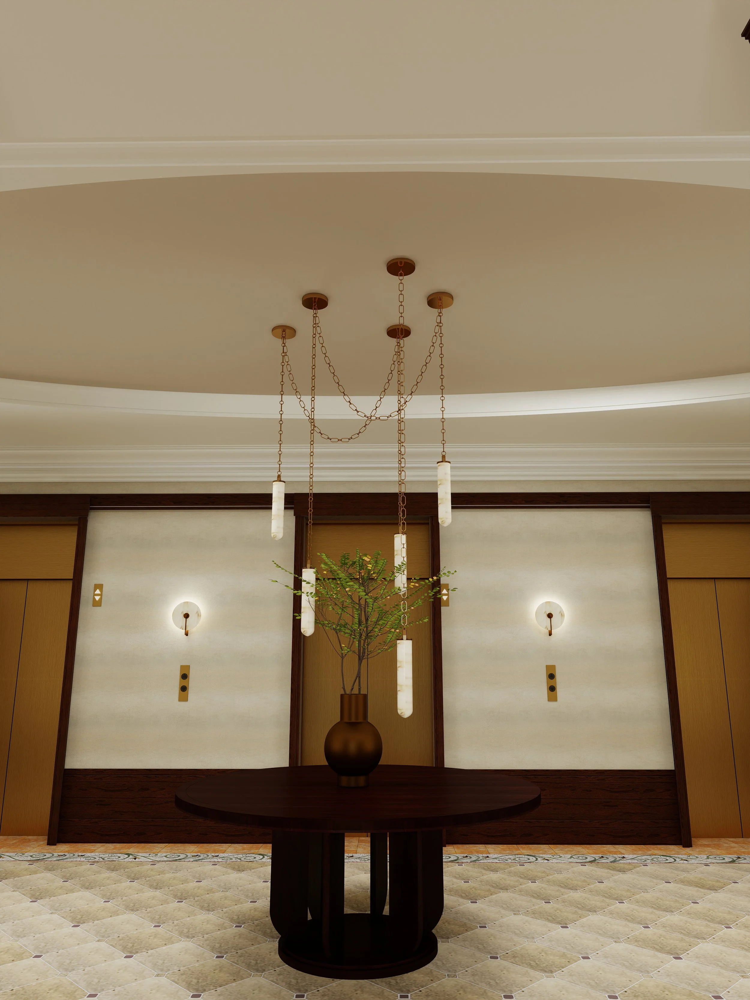 A decorative interior space featuring a round table with a tall dark vase holding a green plant. Above, a modern chandelier with hanging cylindrical light fixtures and chains is suspended from the ceiling. The background shows a wall with gold, white