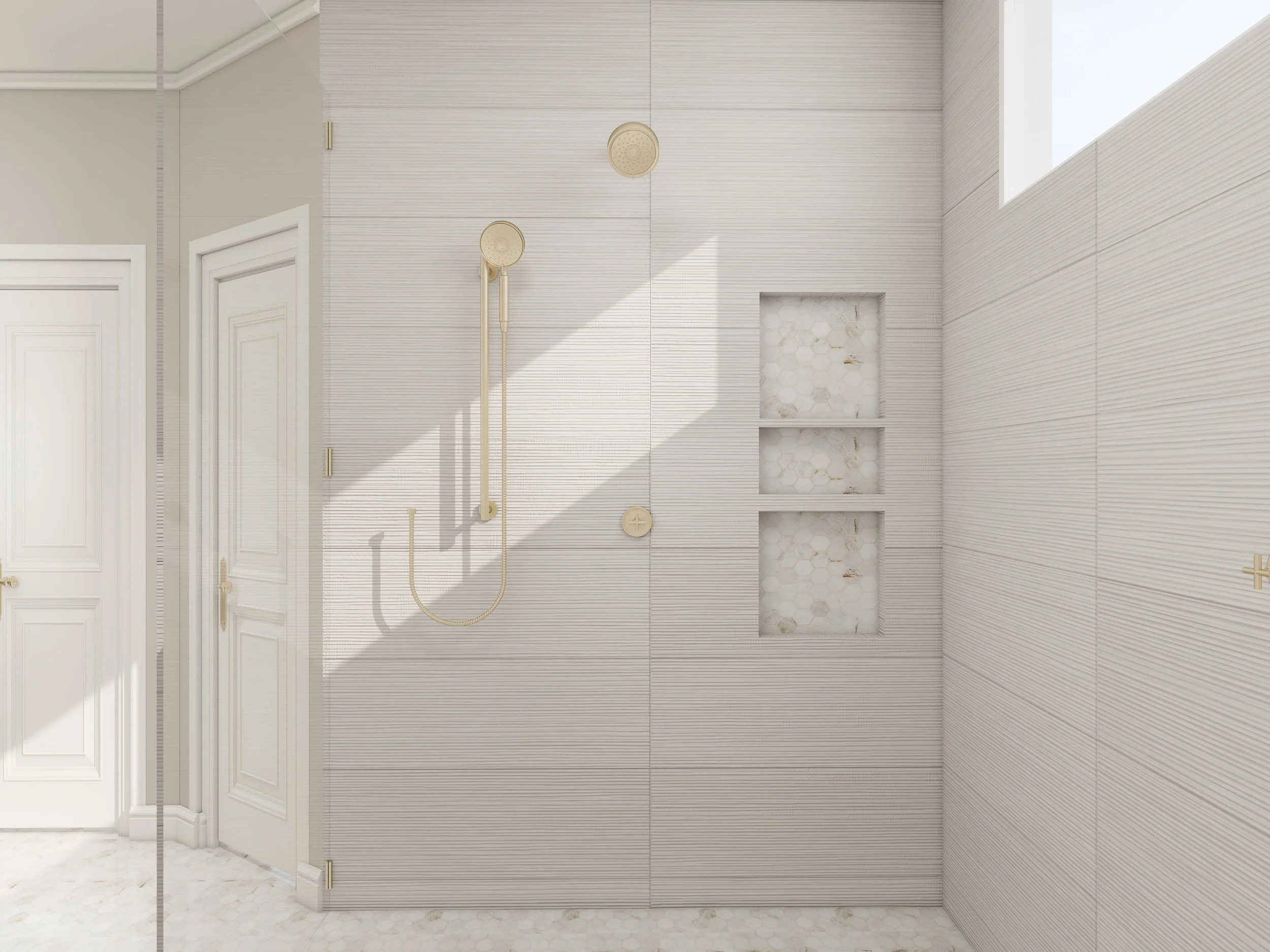 Shower area with two handheld showerheads mounted on a wall with light-colored horizontal striped tiles. There are two recessed shelves in the wall with hexagonal tile backs. The floor is covered with similar hexagonal tiles, and part of a white door