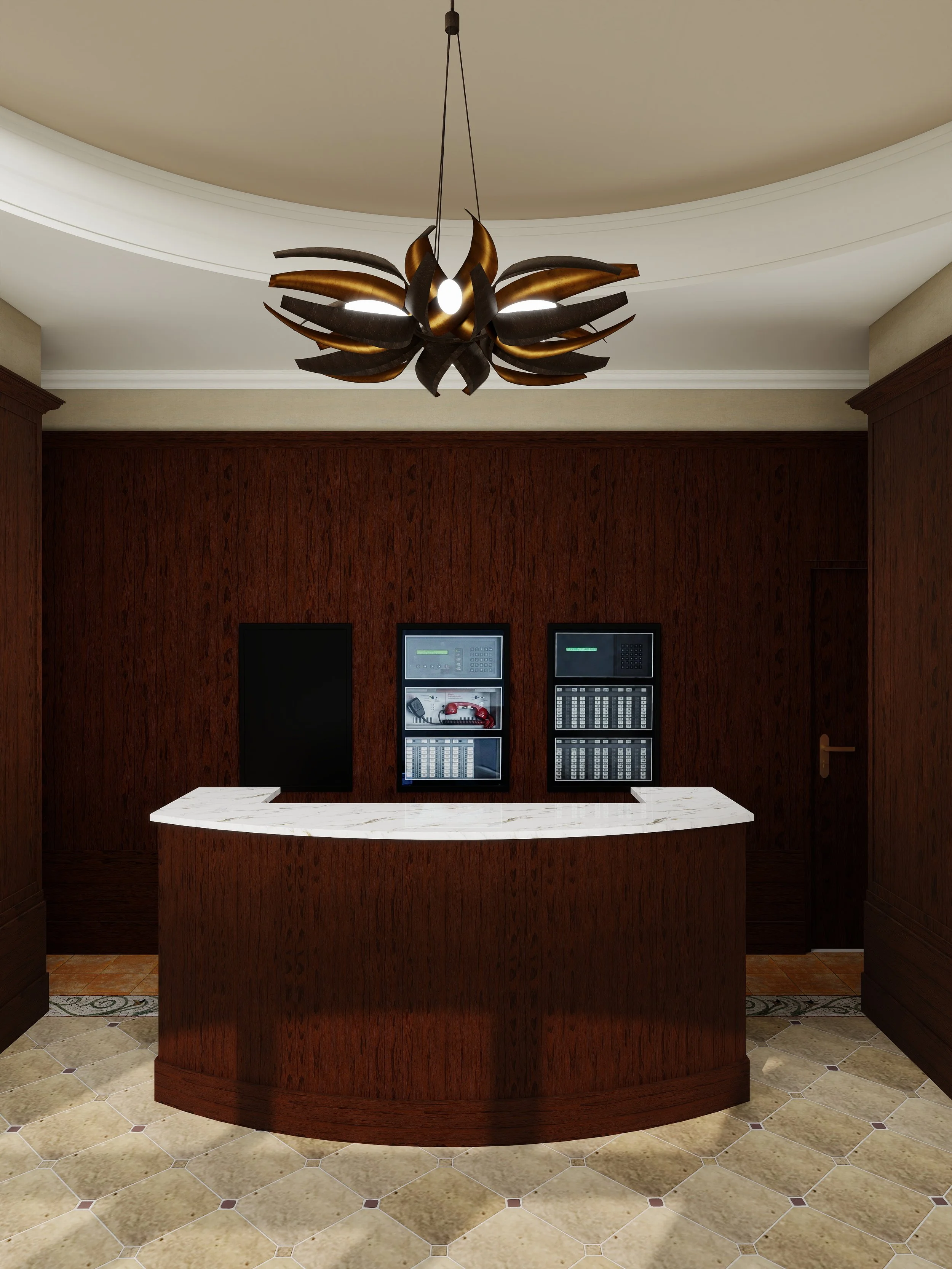 A wooden reception desk with a marble countertop in a lobby area, with a wall behind displaying electronic security panels.
