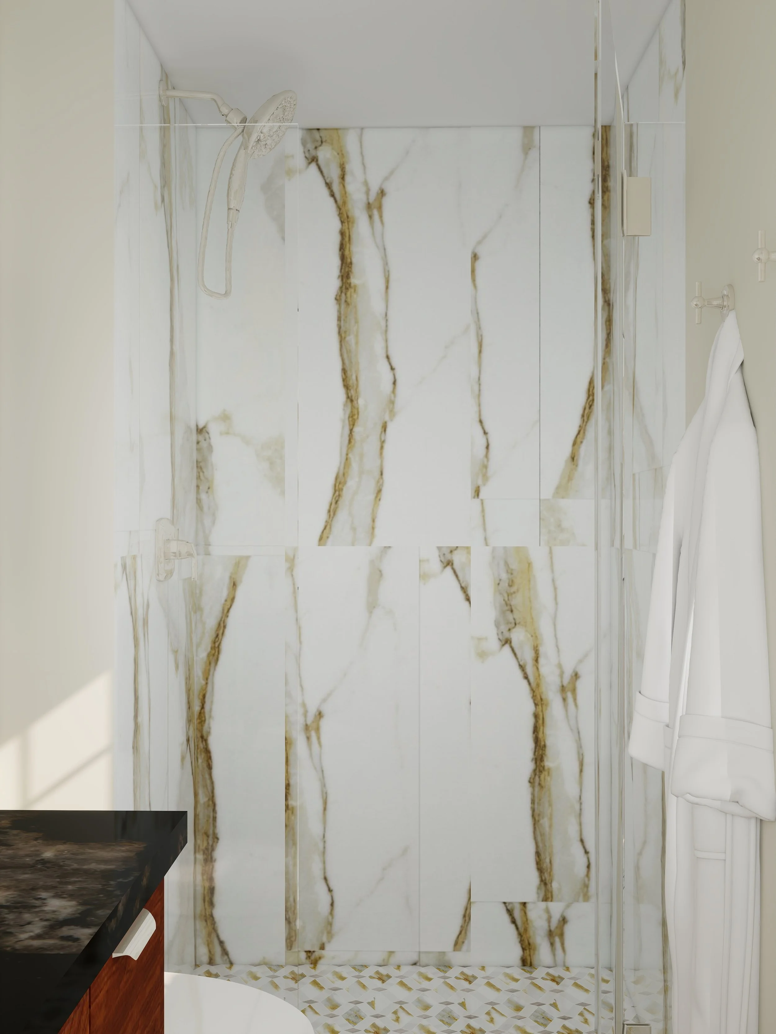 A modern walk-in shower with large marble tiles featuring gold and white veining on the walls. The shower has a rainfall shower head and a handheld shower attachment. To the right, there is a towel hanging on a hook, and a small corner of a dark-colo