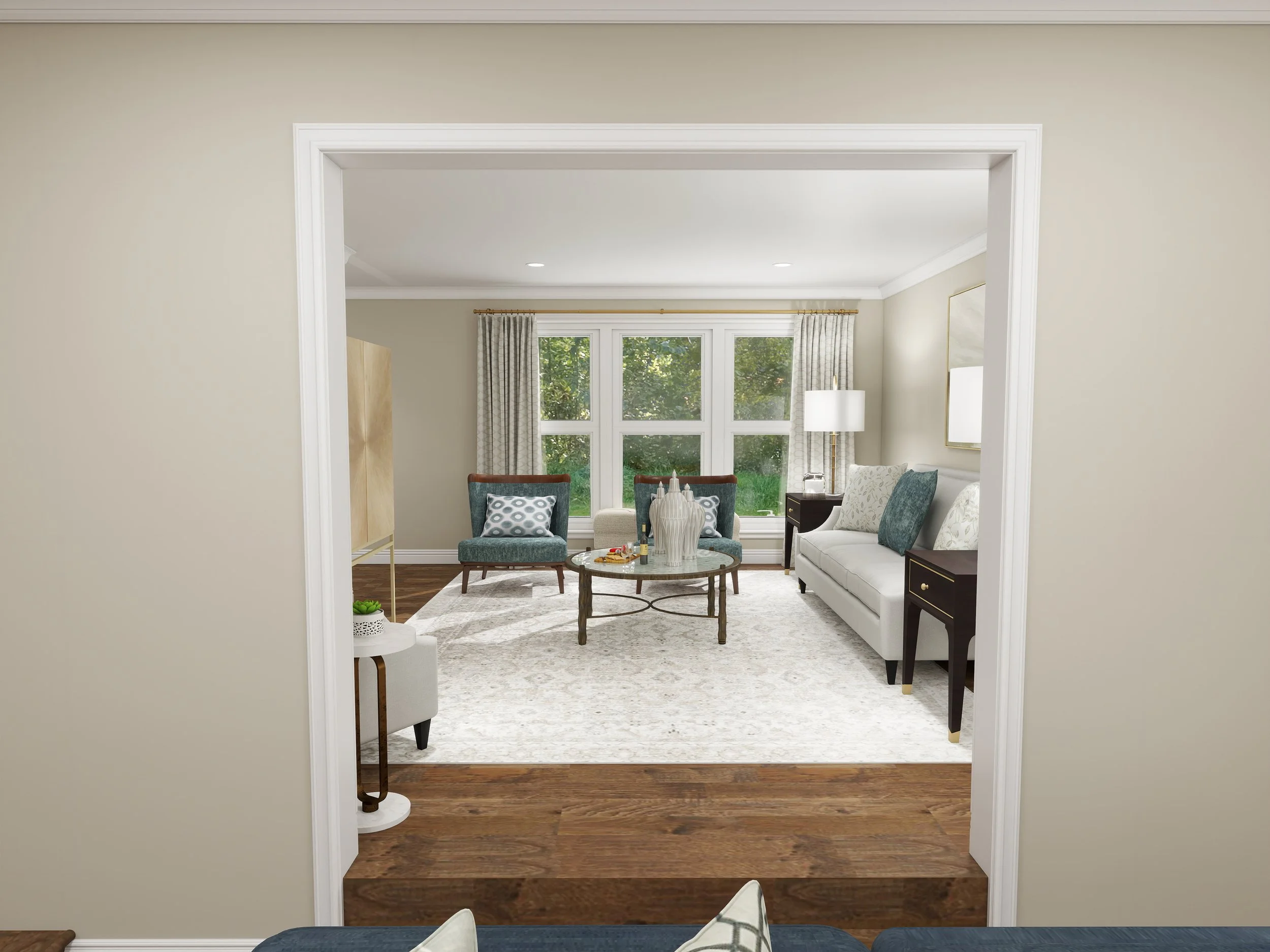 Living room with large window, curtains, round coffee table, chairs, and sofas.