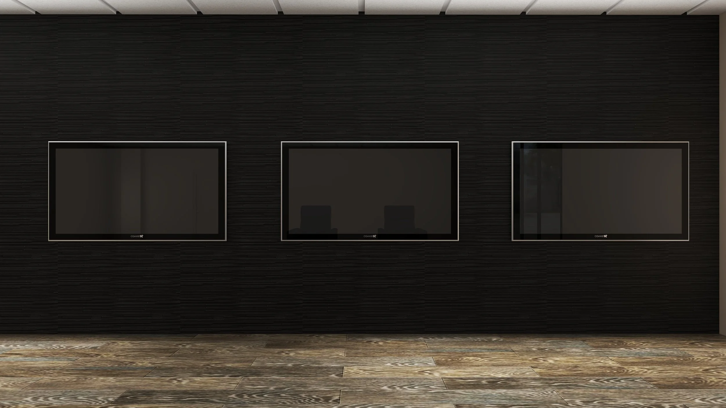 Three flat-screen televisions mounted on a black textured wall above a wooden floor.