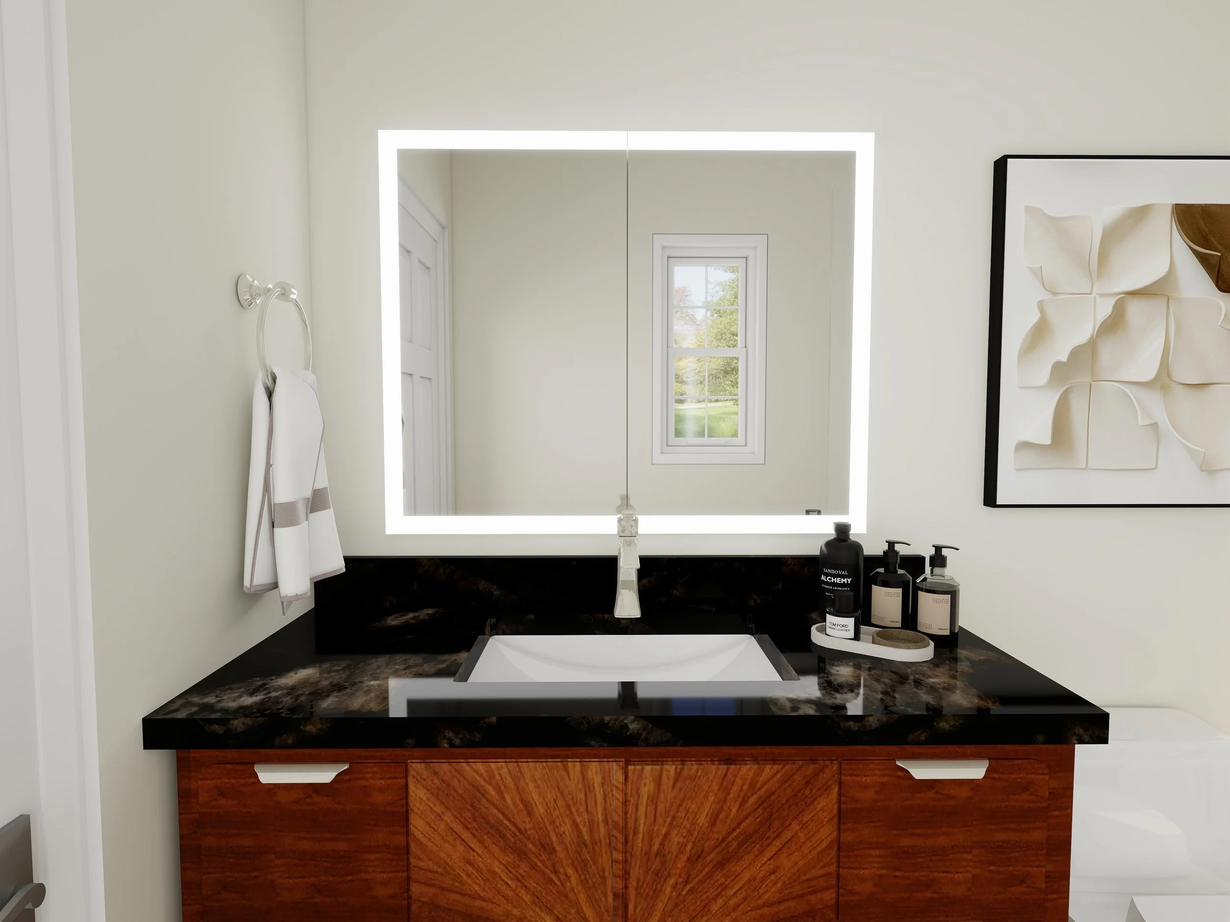 Bathroom vanity with a marble countertop, a large mirror with built-in lighting, a small window, and various bottles of toiletries on a tray, with a towel hanging on a hook on the wall.