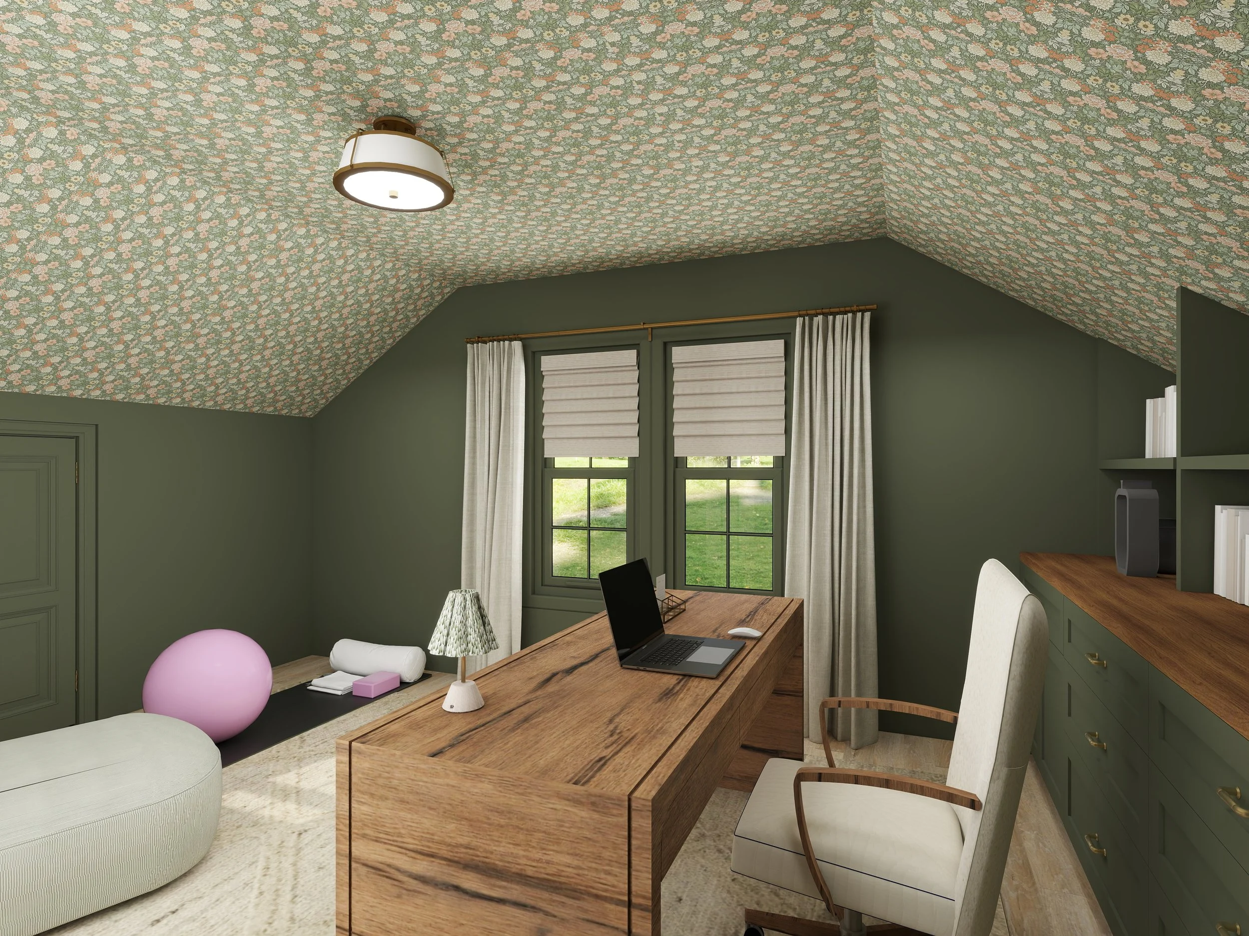 Attic room with green walls and floral-patterned ceiling, window with curtains, wooden desk with laptop, white chair, and a pink exercise ball.