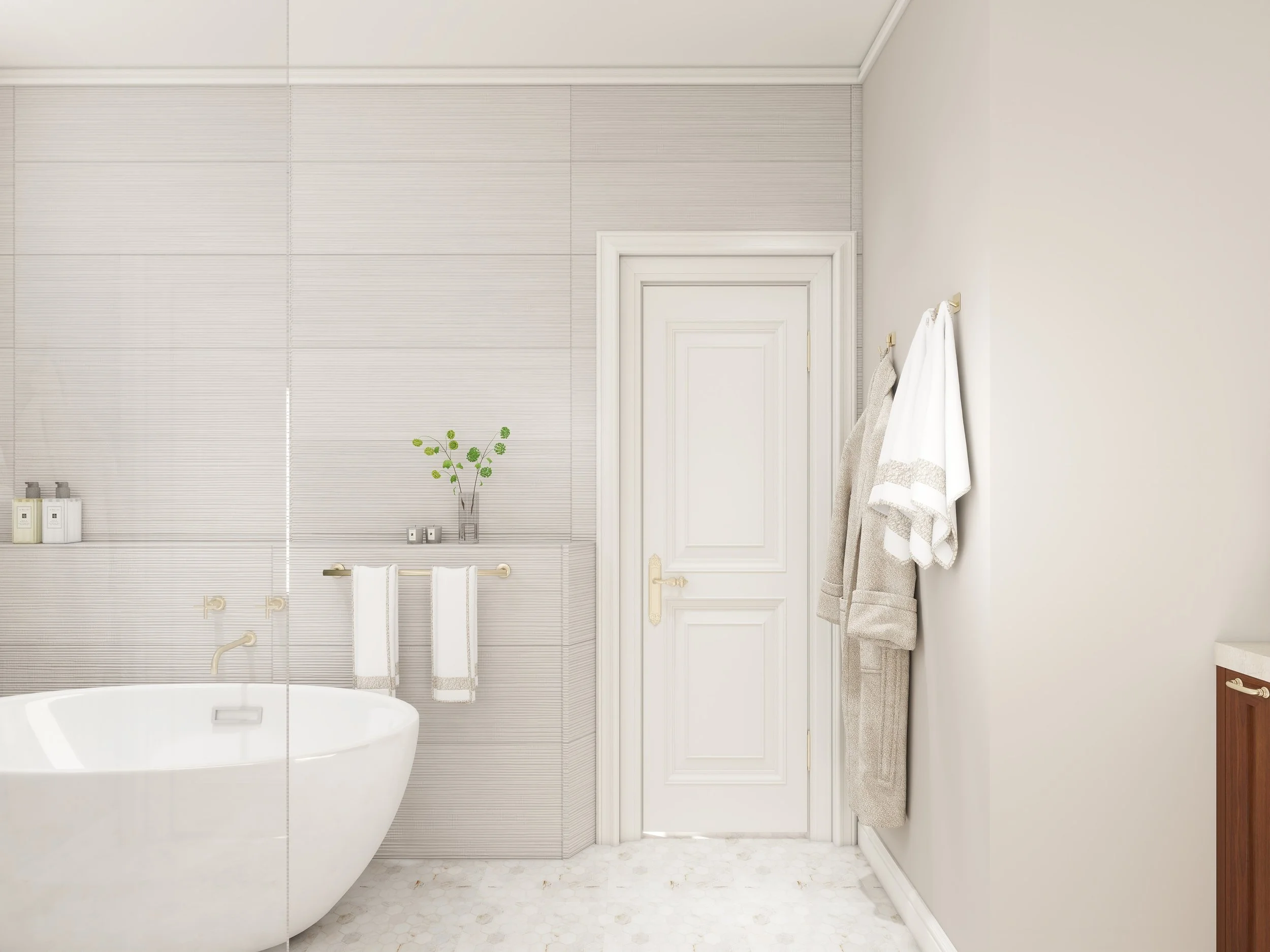 A minimalist, modern bathroom with a white bathtub, beige textured tiles, and a white door. There are towels hanging on hooks on the right and a small potted plant on the wall.