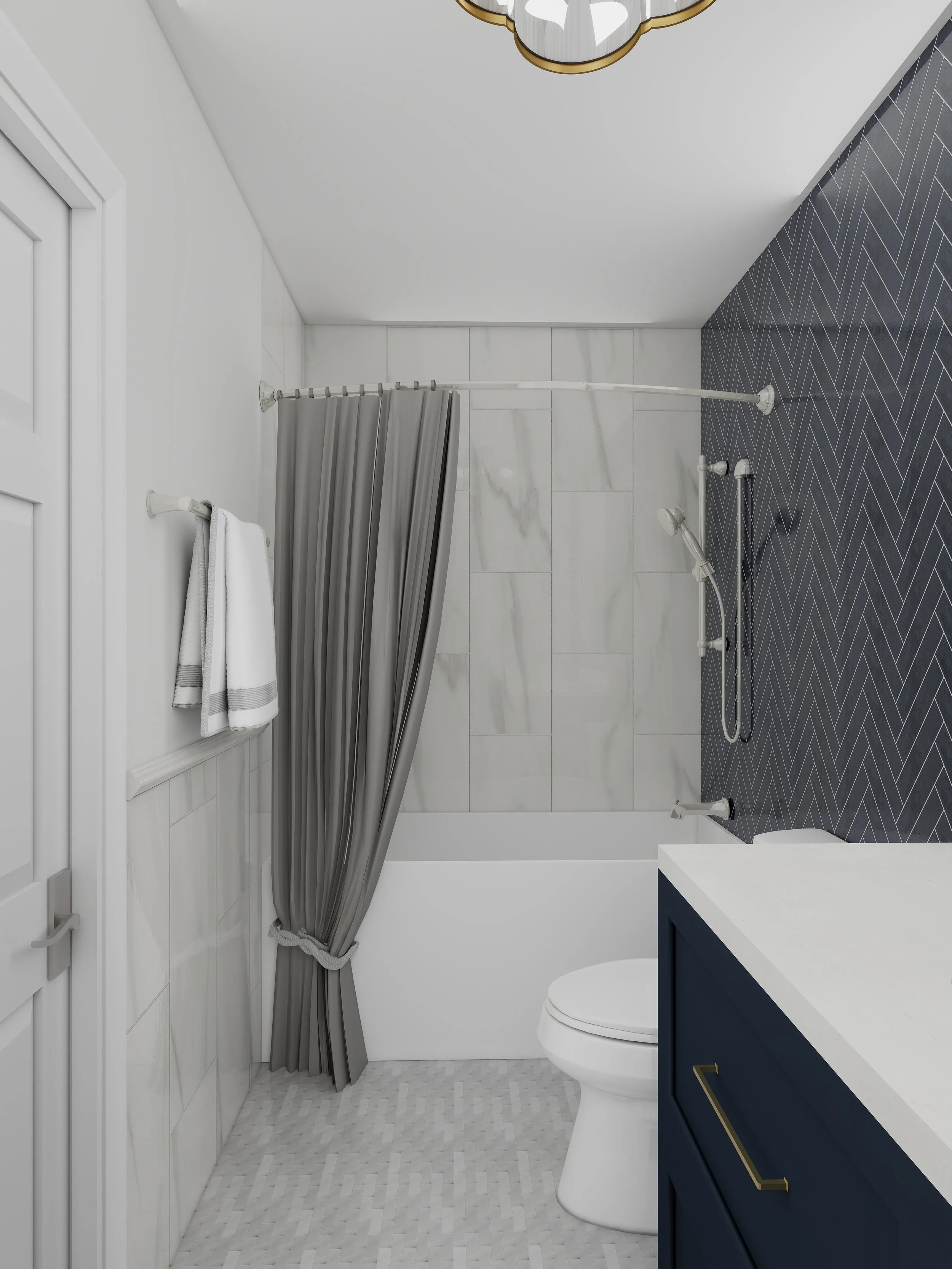 A modern bathroom with a white toilet, navy vanity with a white countertop, and a shower area with a grey striped shower curtain, white marble and wood-look tile flooring, and white tiled walls.