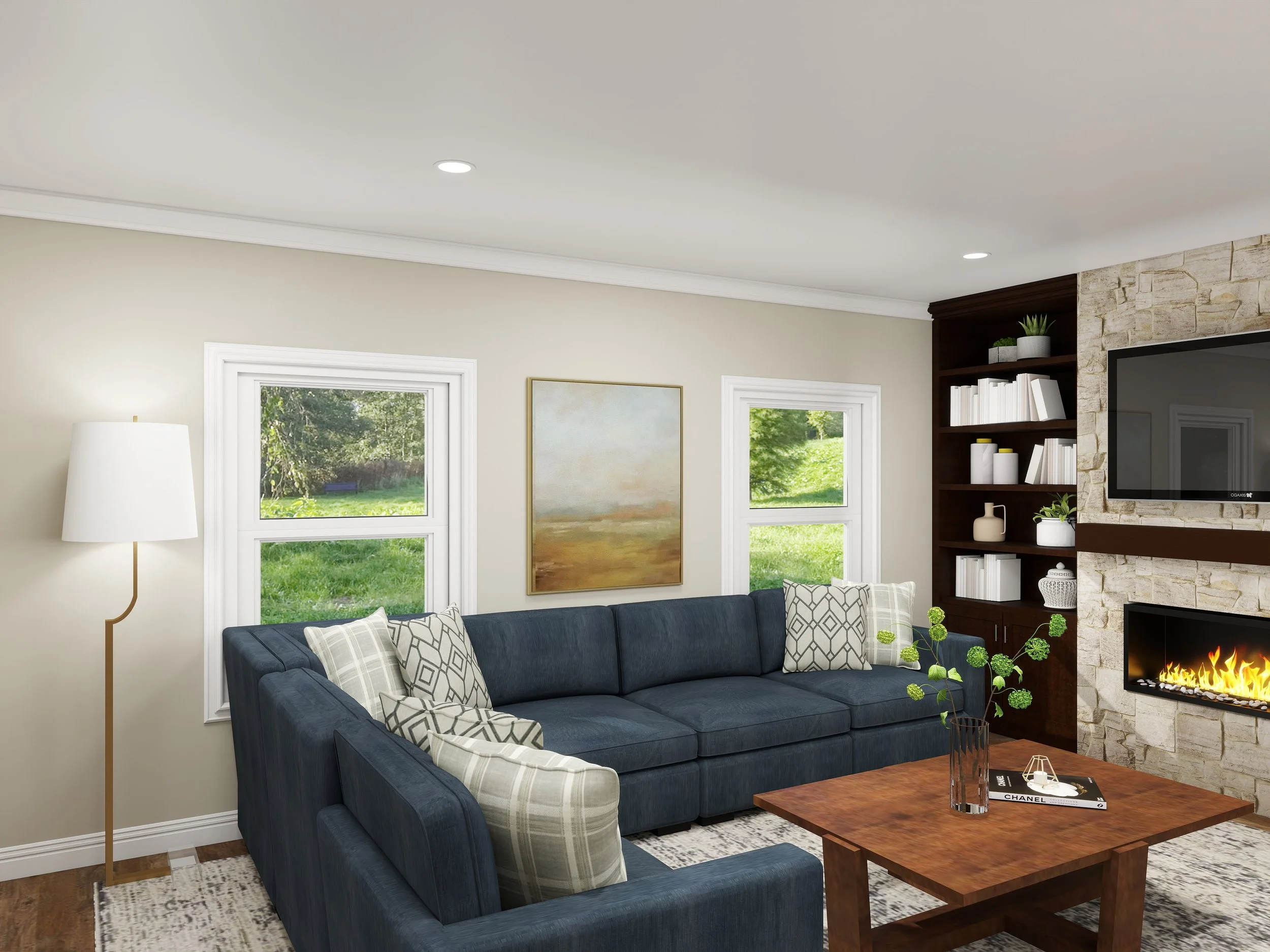 Living room with a navy blue sofa, patterned accent pillows, a wooden coffee table, fireplace, built-in bookshelf with plants and books, large windows showing greenery outside, and a tall white floor lamp.