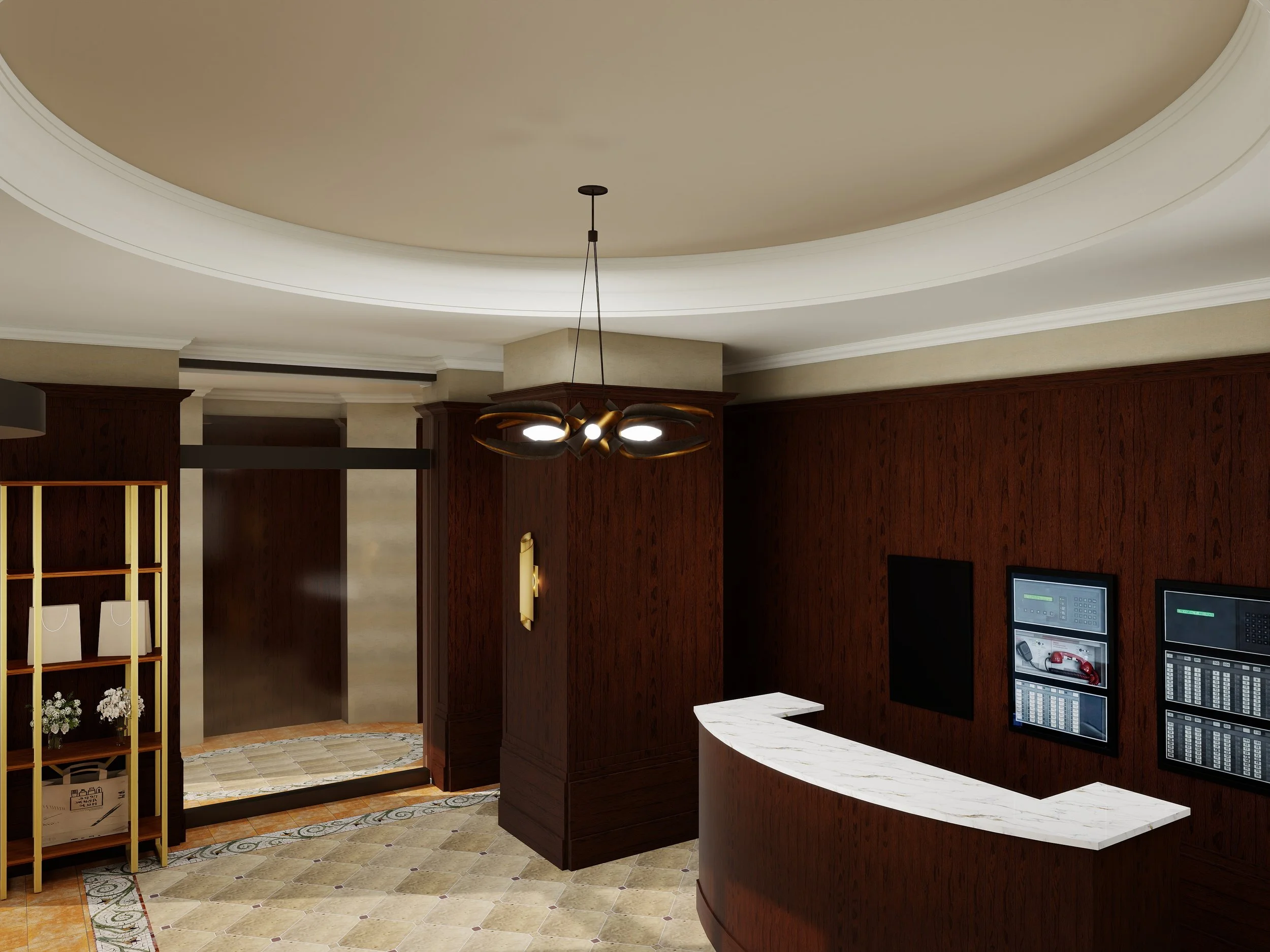 Interior view of a hotel lobby or reception area with a beige ceiling, wooden paneling, a chandelier and two television screens mounted on the wall.