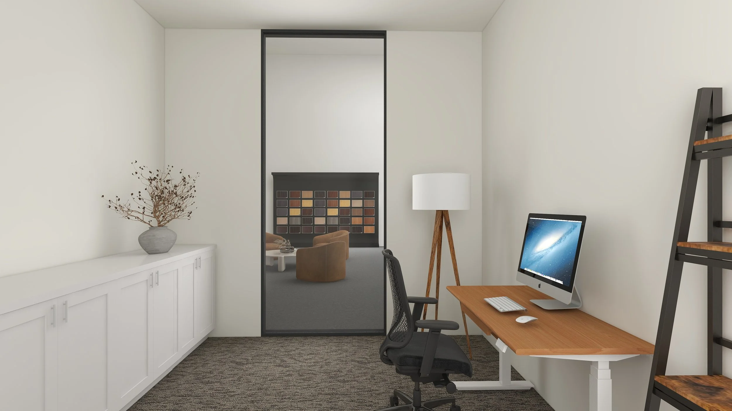 An office space with a white wall, a desk with an iMac, a black office chair, a wooden ladder shelf, a standing lamp with wooden legs, and a large white cabinet with a decorative vase with dried branches. In the adjacent room, there are brown chairs,