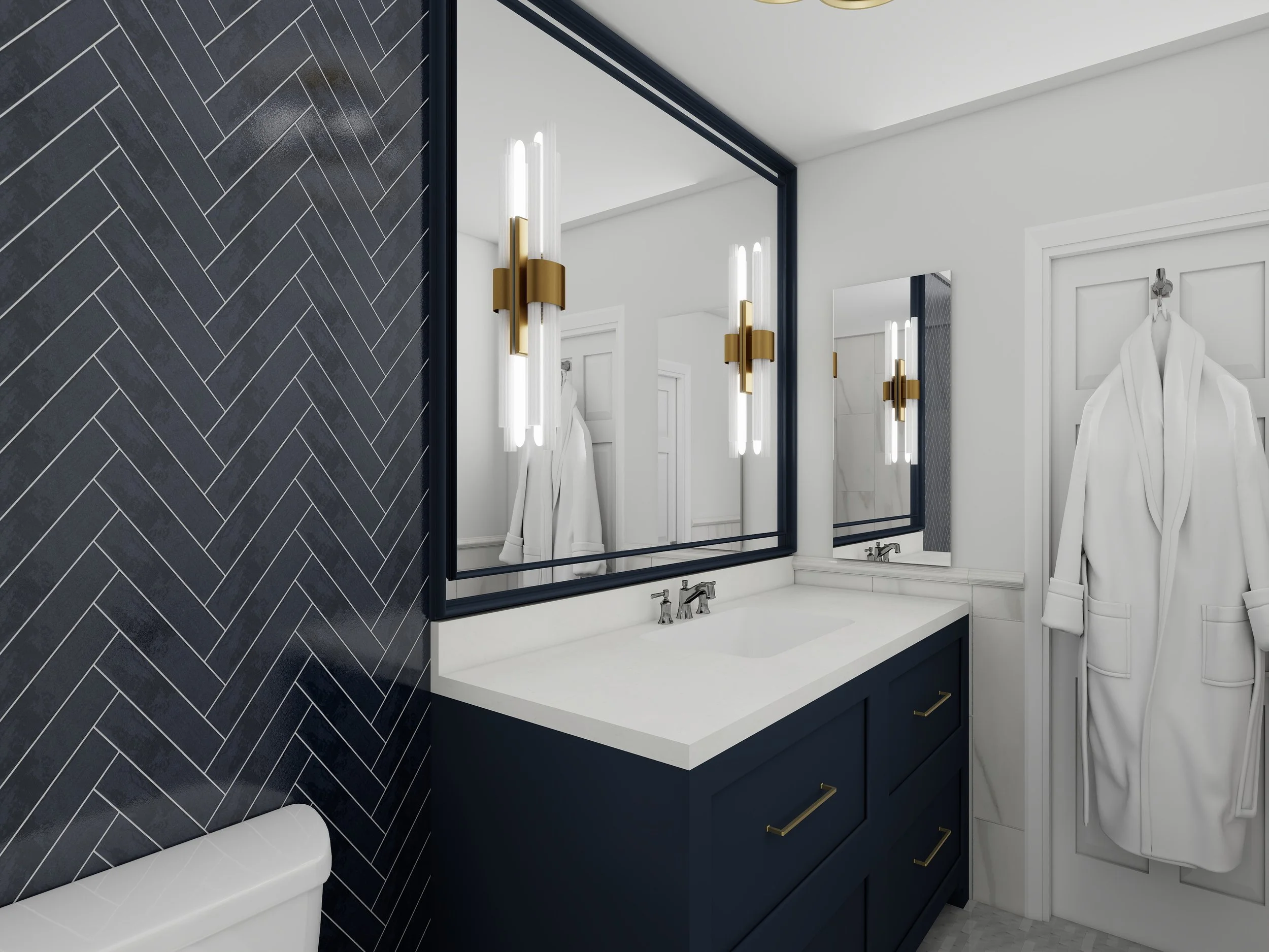 A modern bathroom featuring a white vanity with navy blue cabinetry, a large rectangular mirror, wall-mounted light fixtures with gold accents, a white countertop with two sinks, and a towel hanging on the wall. The wall behind the sinks is decorated