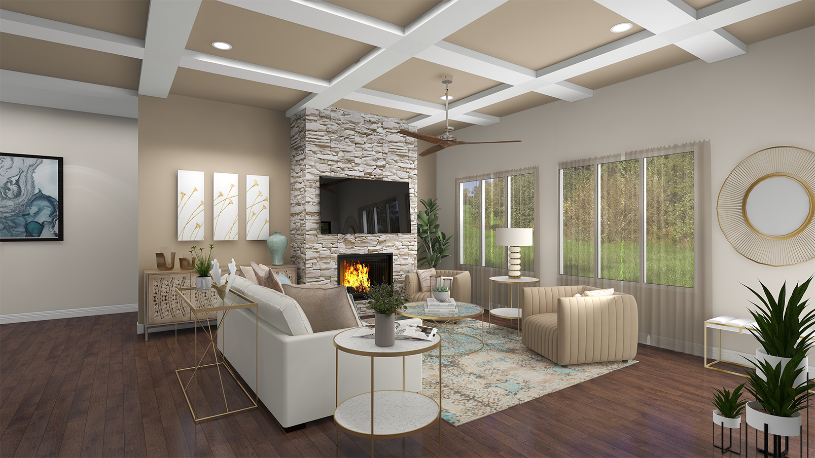 A spacious living room with a modern design, featuring a white sectional sofa, a beige curved armchair, a stone fireplace with a mounted TV, large windows with sheer curtains, a ceiling fan, and decorative plants. Artwork hangs on the walls, and there are side tables with lamps and plants.