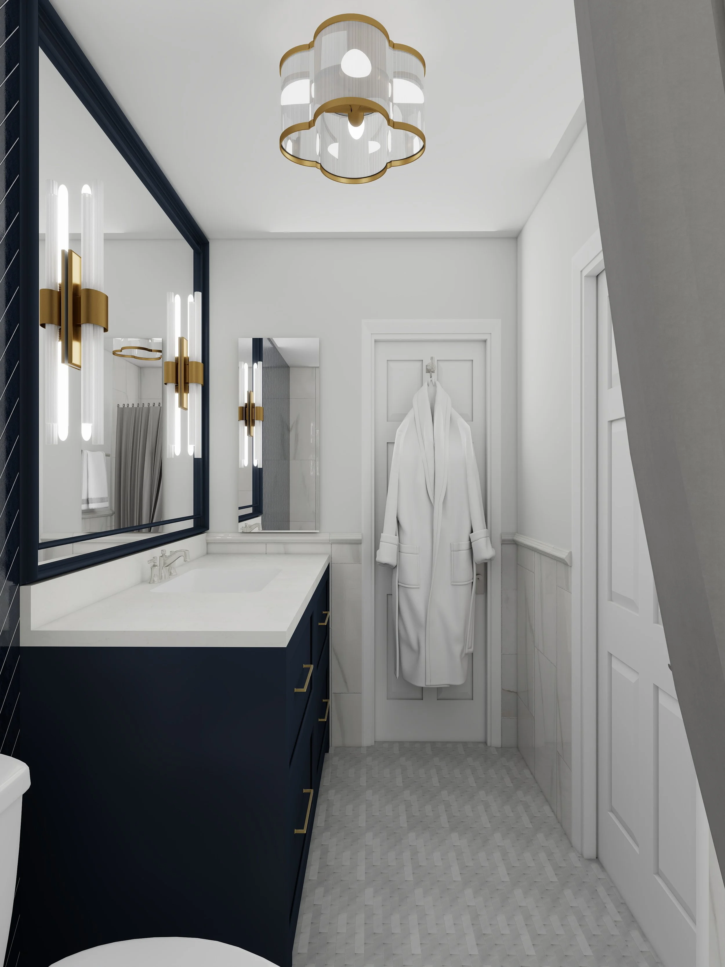 Modern bathroom with dark blue vanity, white countertop, and large mirror. White walls, gold fixtures, and a ceiling light with a geometric design. A white robe hangs on a hook on the door.