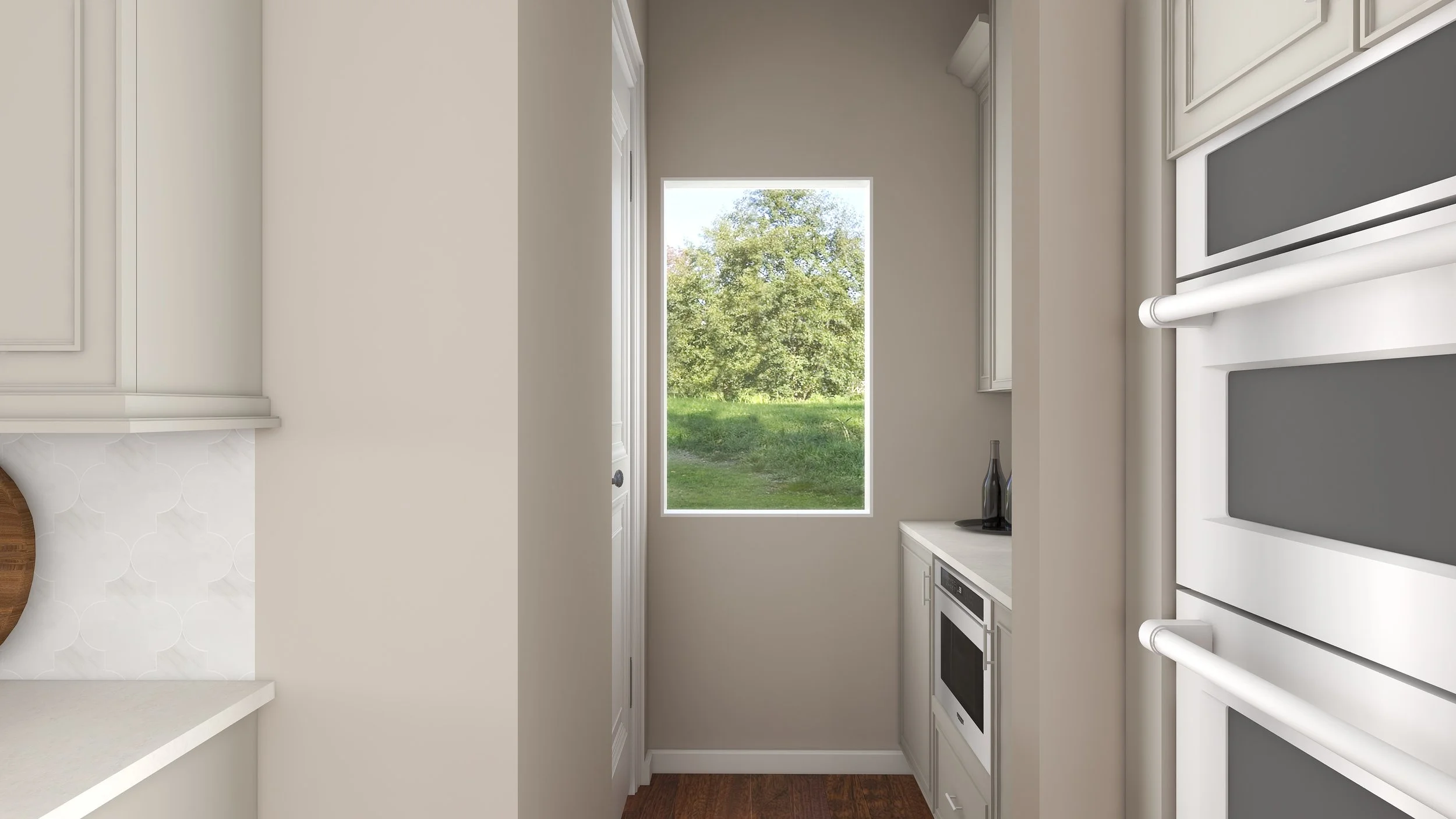 View of a modern kitchen with white cabinets and built-in appliances, a window overlooking a green outdoor area with trees.