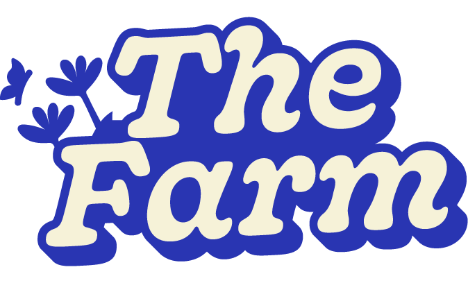 Text logo reading 'The Farm' with blue and white lettering, decorated with small blue flower illustrations.