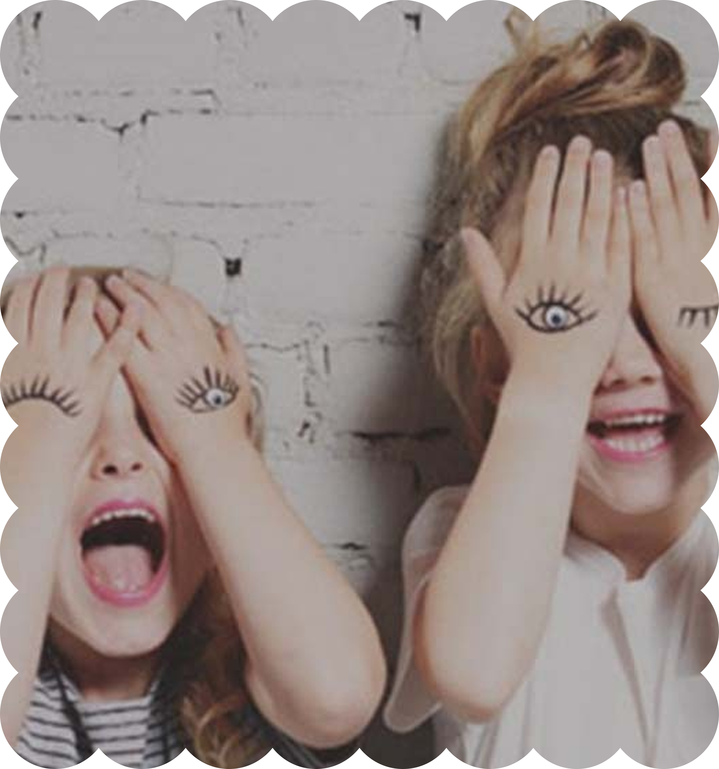 A collection of paper cutouts of faces with colorful hair, eyes, and mouths, arranged on a surface.