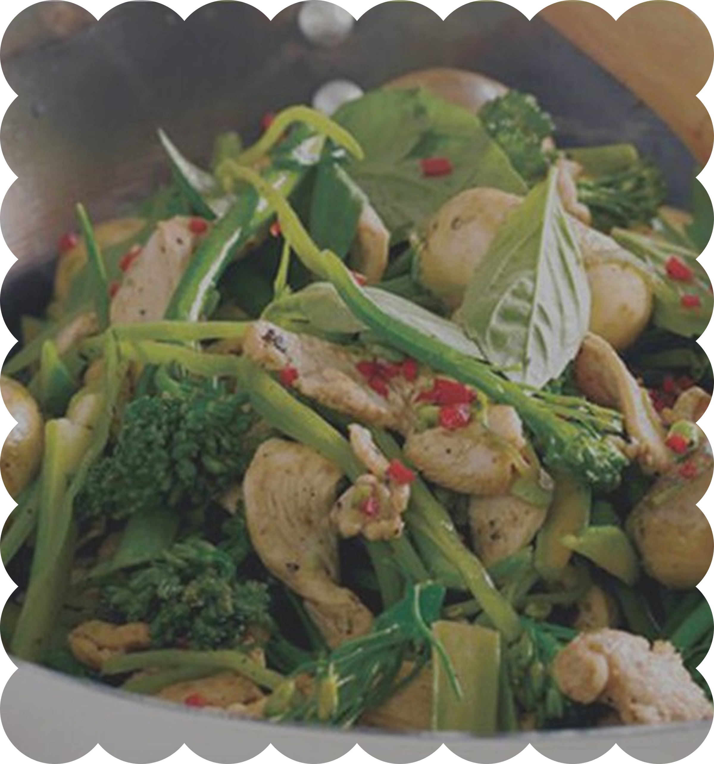 A bowl of salad with various greens, vegetables, and possibly chicken or tofu pieces.