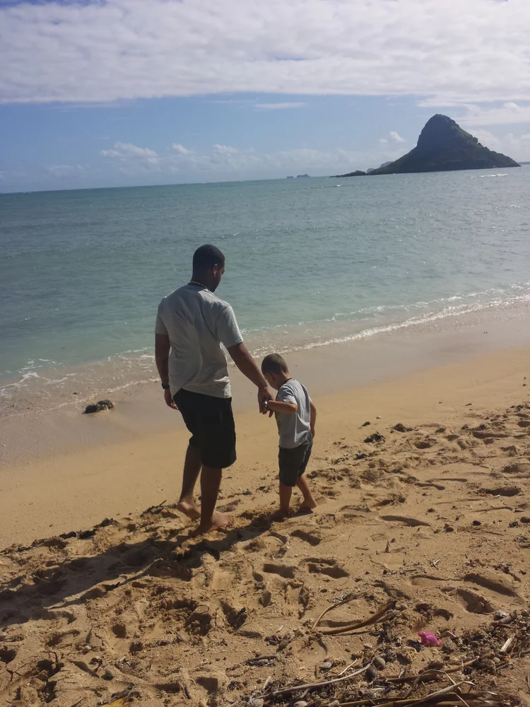 Father and child on the beach