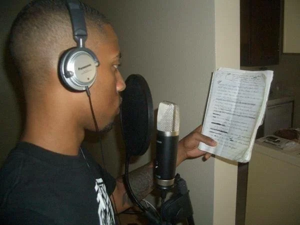 At the microphone in the studio