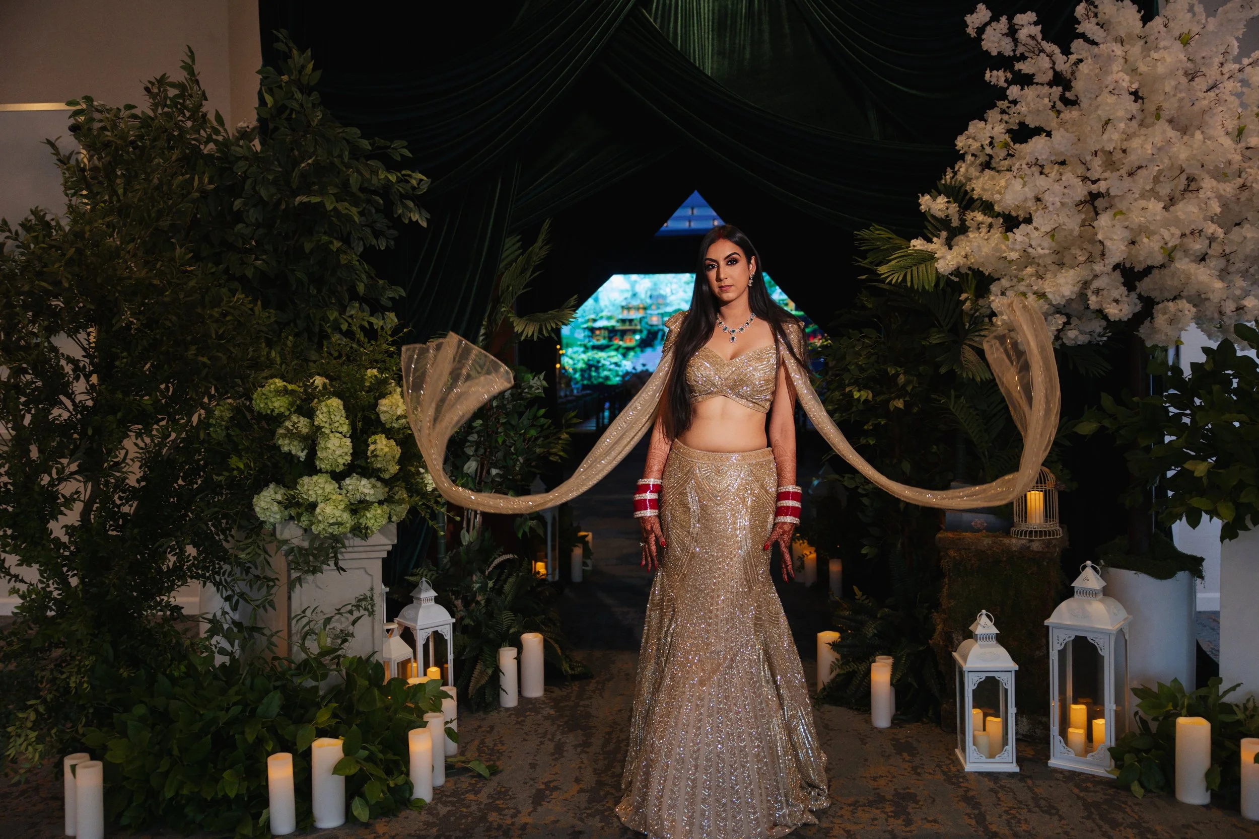 Bride in reception gown during South Asian wedding reception, Los Angeles