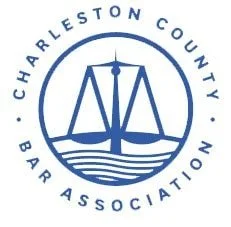 Logo of Charleston County Bar Association featuring a stylized sailboat and scales of justice.