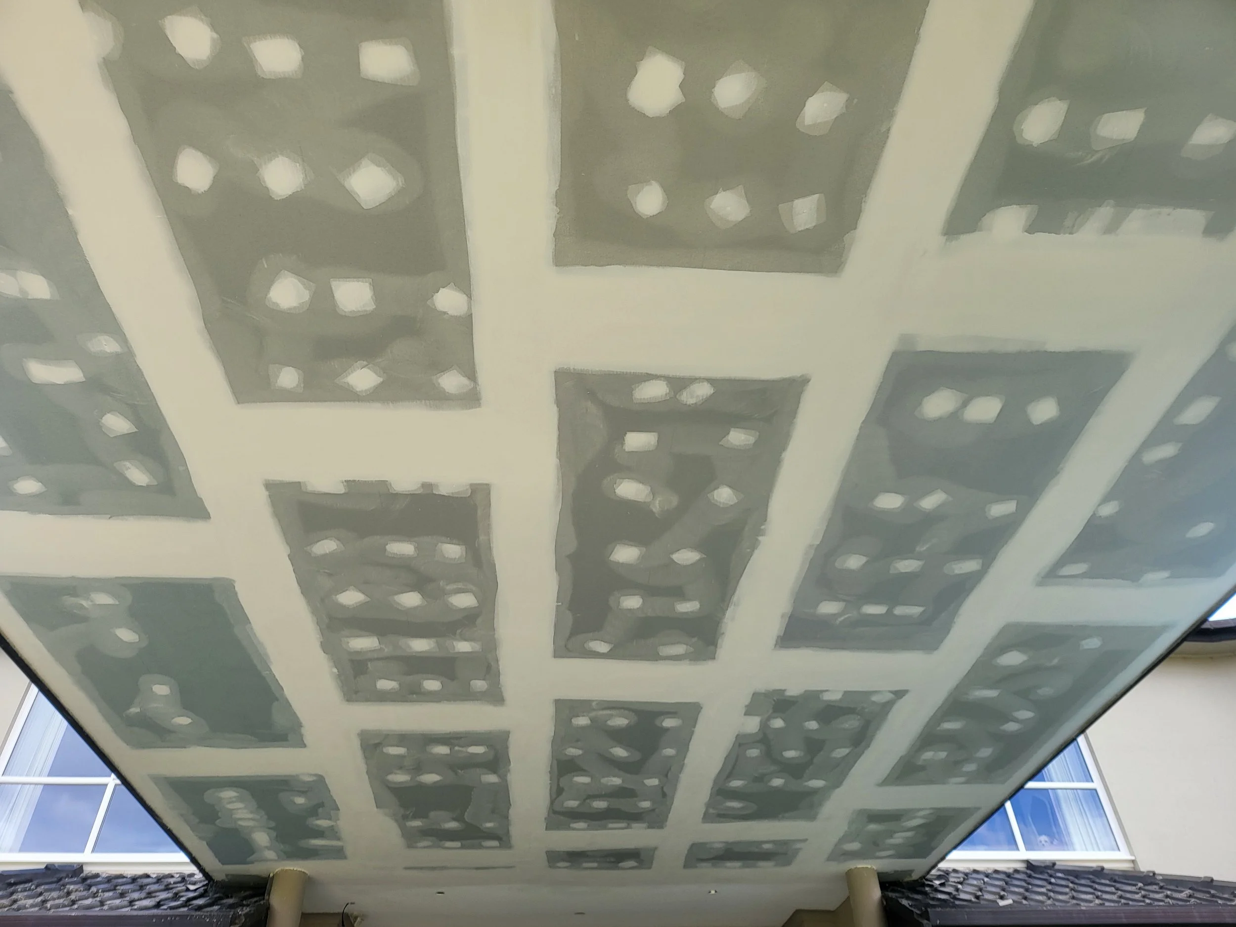 Oranssi technician working on a roof project