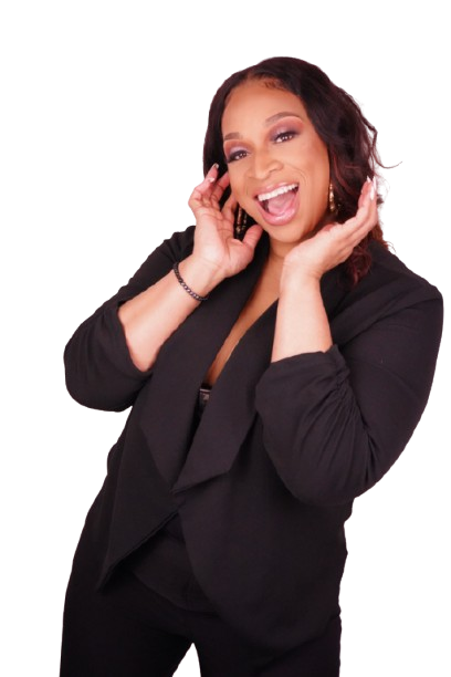 Woman with dark, curly hair wearing a black outfit, smiling and touching her face with both hands.