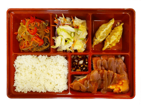 A school lunch tray with noodles, a salad, spring rolls, rice, soy sauce, and sliced meat in sauce.