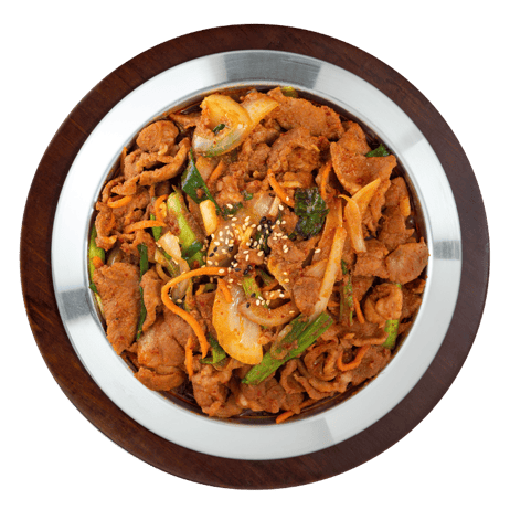 A bowl of stir-fried vegetables and meat topped with sesame seeds.