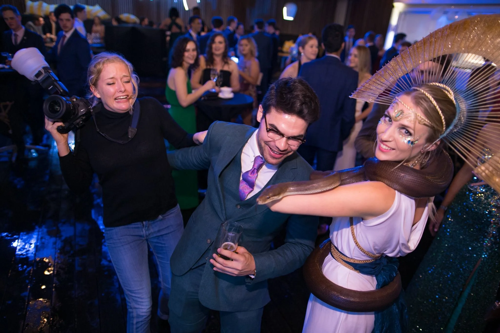 From 2017, I worked as an event photographer for UQ Union (and ended up becoming the Head Photographer). I didn't like snakes, so this party trick became a bit of a joke!

Neither of us (admittedly) wanted to take photos near the snake so we took tur