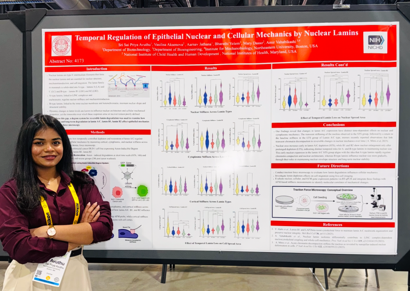 Young woman presenting scientific research poster on nuclear lamins at a conference.