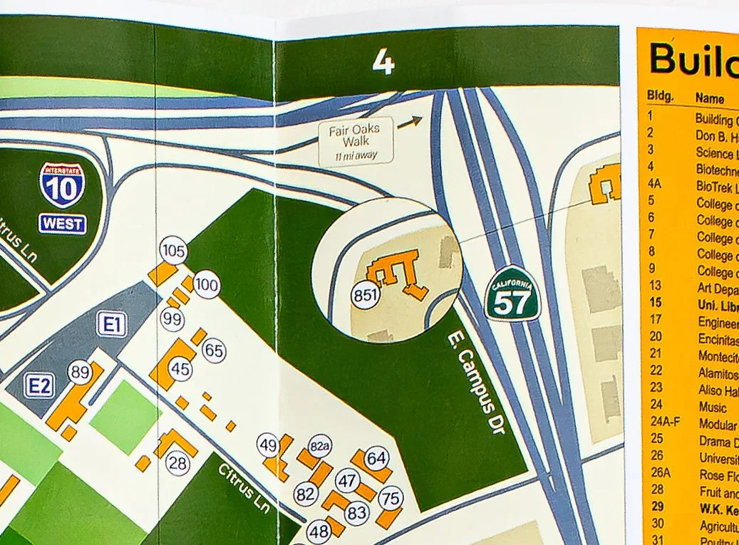 Map of the university campus showing buildings, roads, and highways, including Interstate 10 West and California 57, with labels for building numbers and names, and surrounding streets.