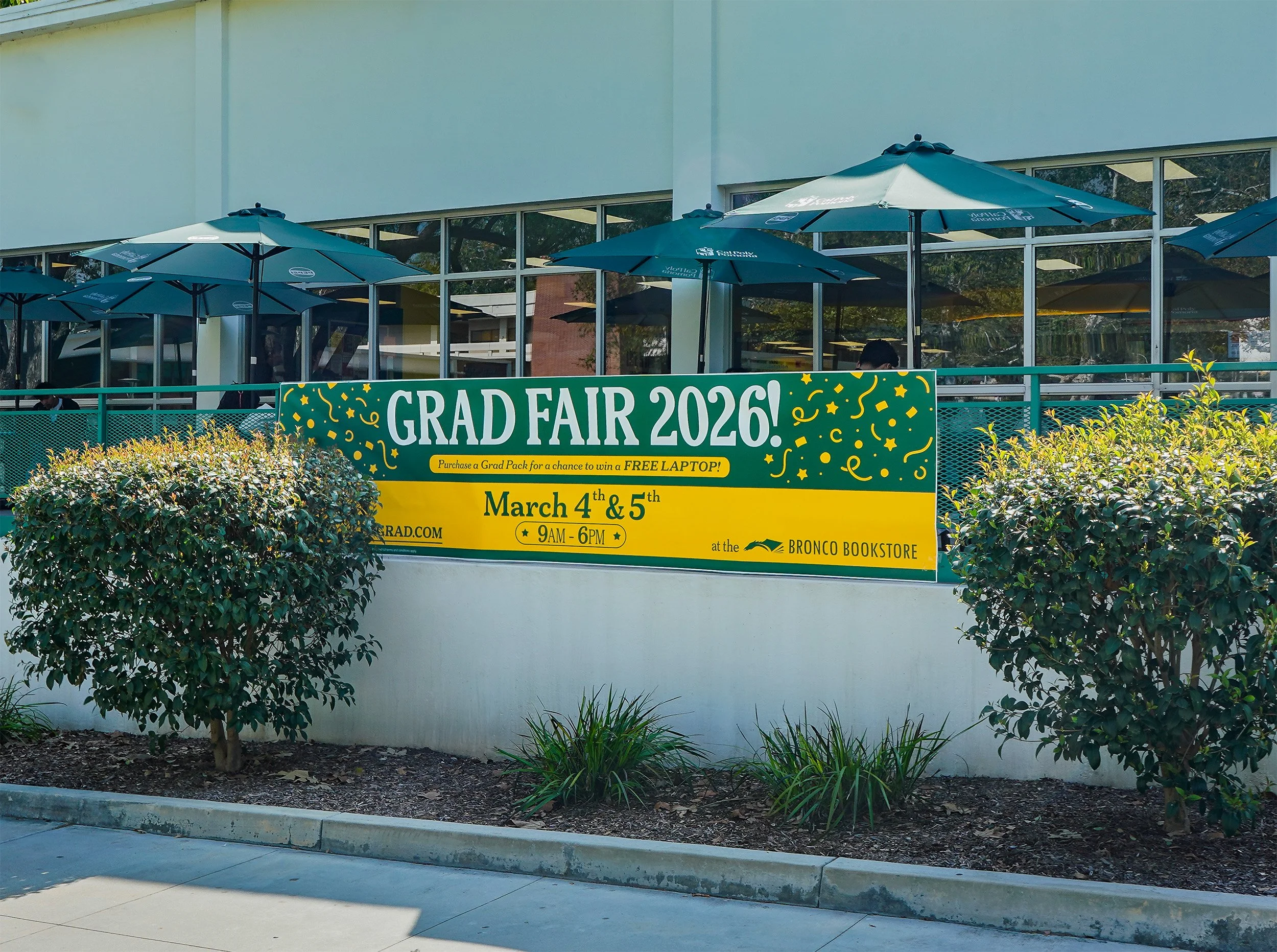 Bright green banner promoting a graduation fair event on March 4th and 5th, 2026, at the Bronco Bookstore with details about a chance to win a free laptop.