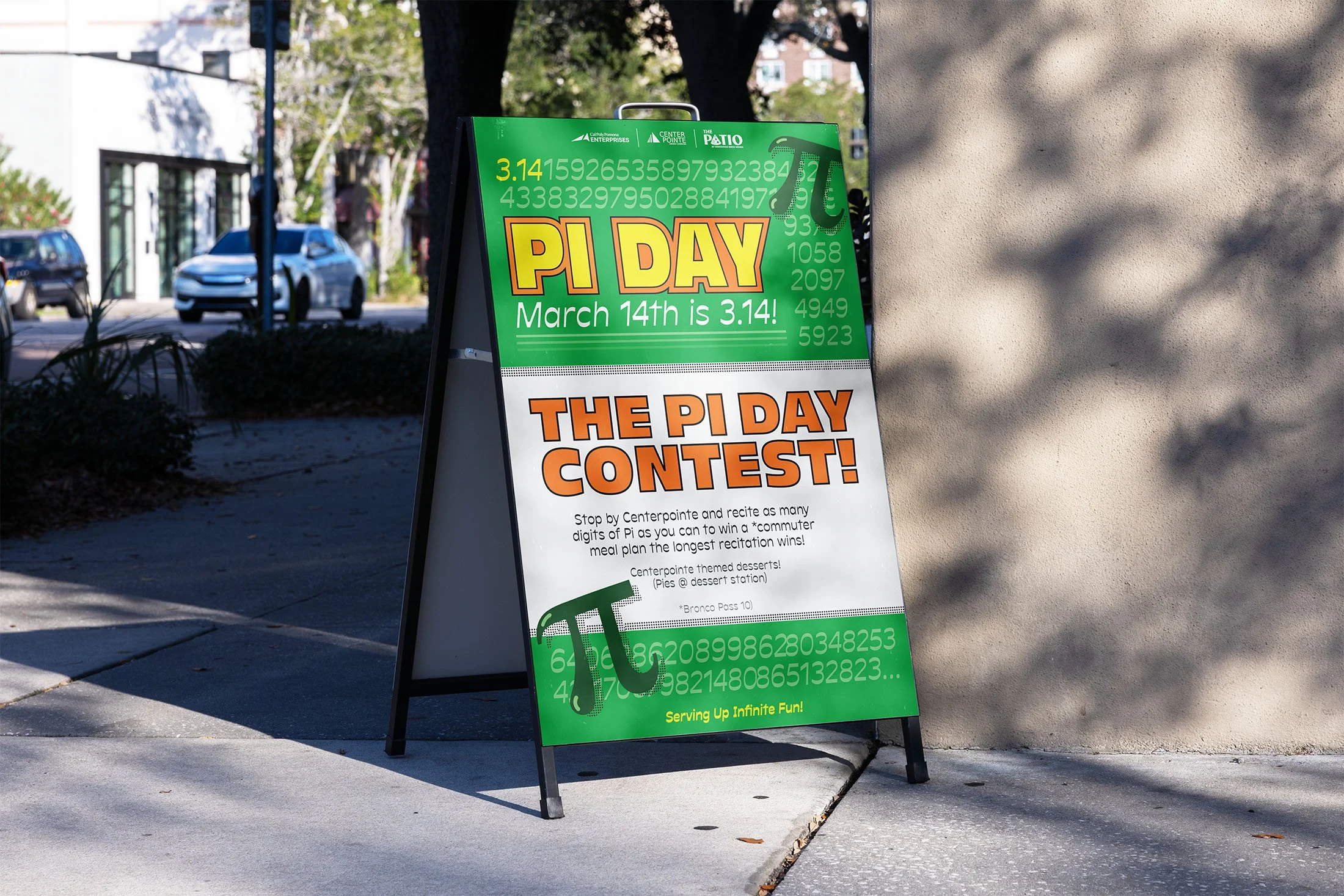 A sidewalk sign promoting Pi Day festivities on March 14th, featuring a green background with mathematical symbols and numbers, and an upcoming Pi Day contest with details for participation.