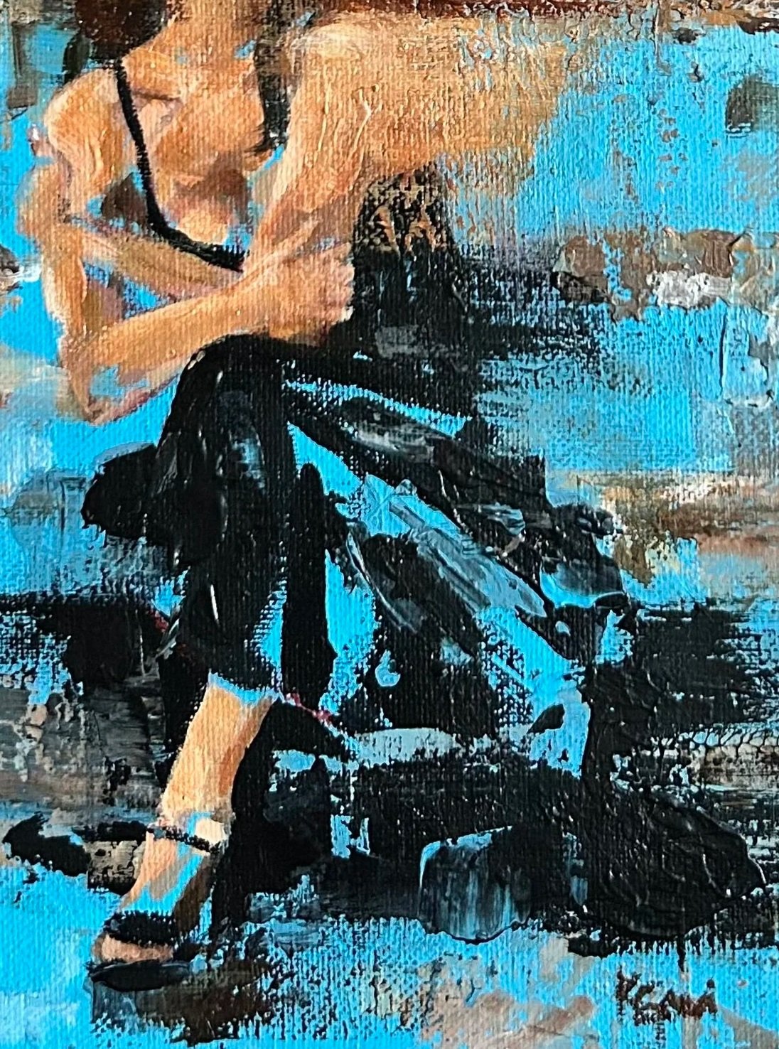 woman sitting on steps painting artwork