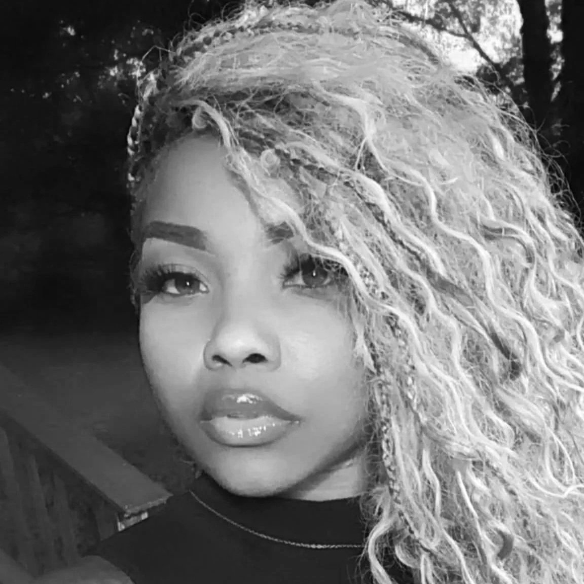 Head shot of Melika - Master Stylist at The Nappy Hutt - ATL