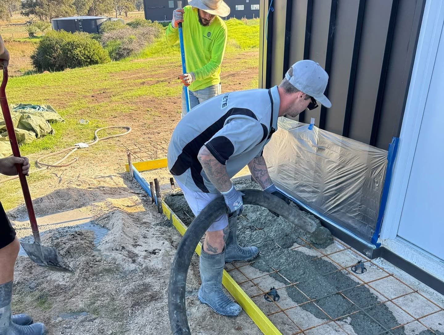 Close up of concrete pump hose and line during an active pour Perth Western Australia