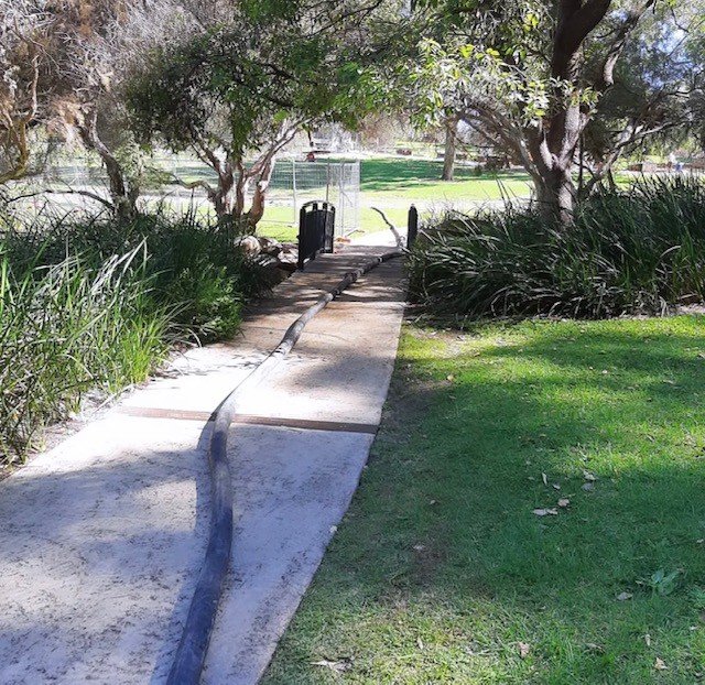 Concrete line pump hose on commercial job site Perth WA