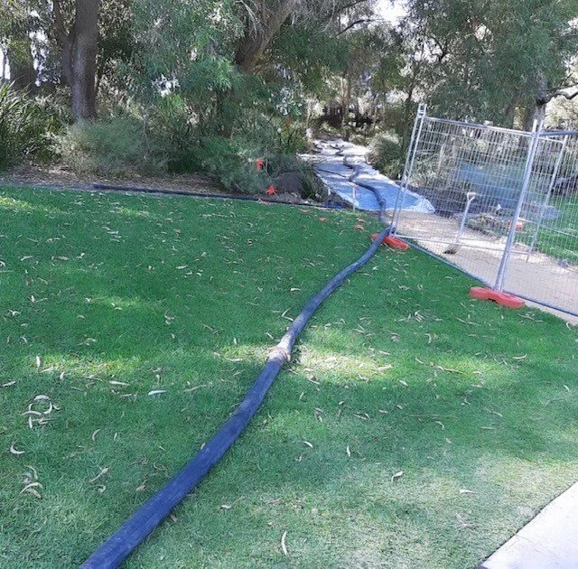 Concrete line pump hose on commercial job site Perth WA
