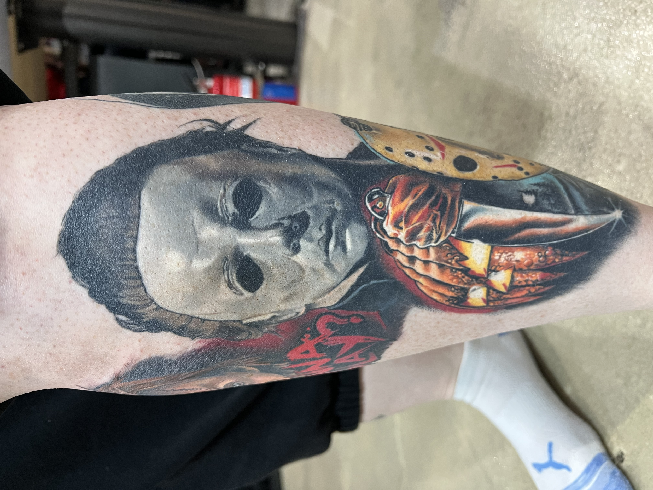 Color Portrait of Micheal Myers from Halloween franchise complemented with the icon Halloween knife and pumpkin image.