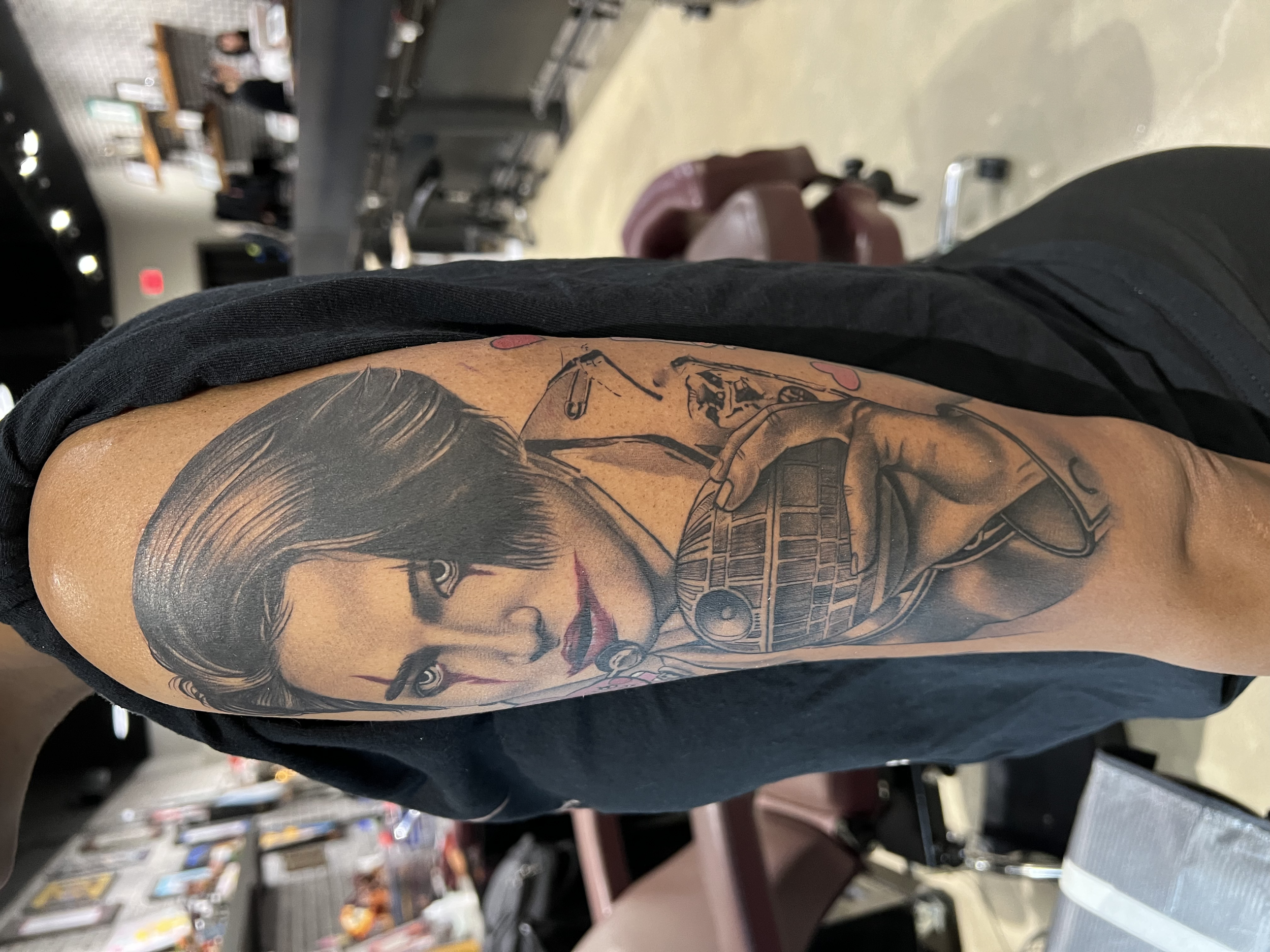 Close-up of a tattoo of K-Pop Star hold the Death Star from Star Wars.