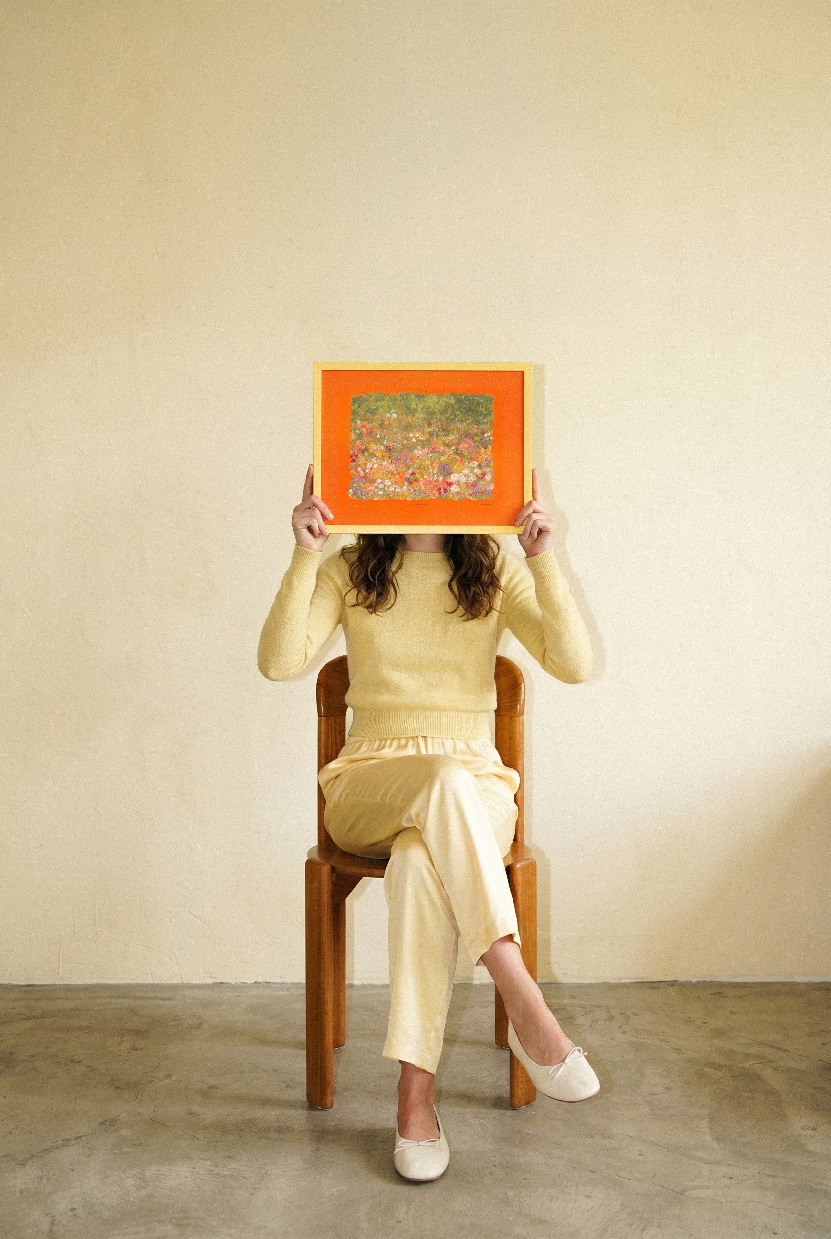 Woman holding framed Bright Hush limited edition art print, oil pastel botanical wall art