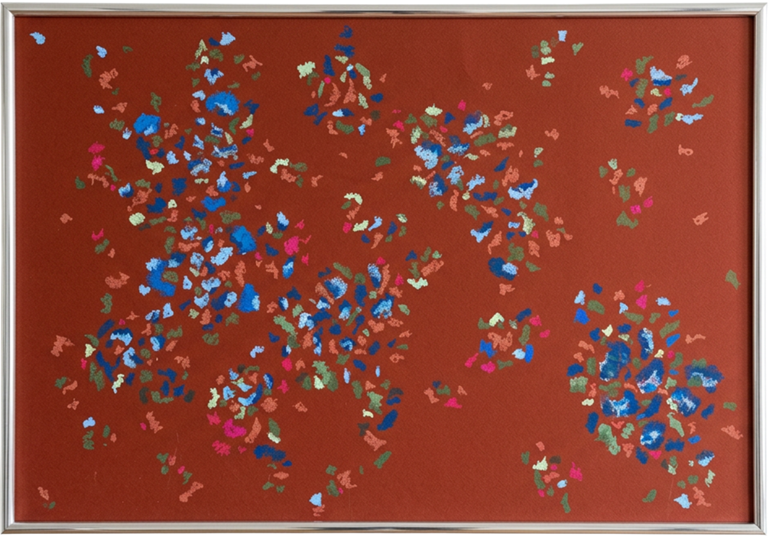 Abstract colored shapes on a red background, resembling scattered confetti or leaves.