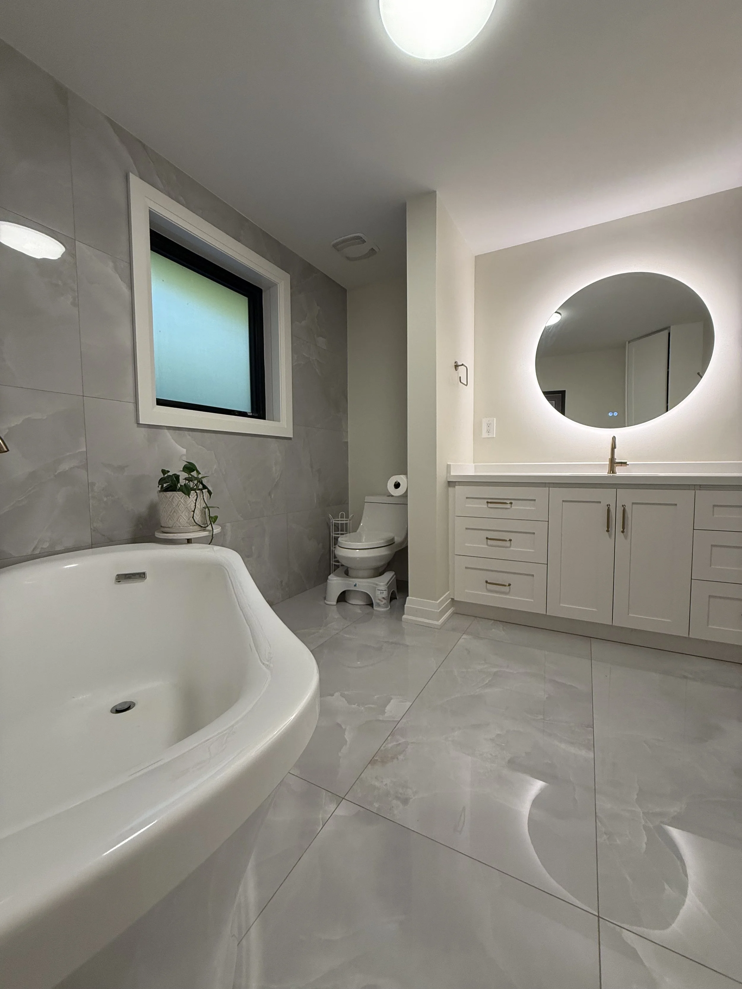 Cottage bathroom renovation with custom vanity completed by Mainframe Developments.